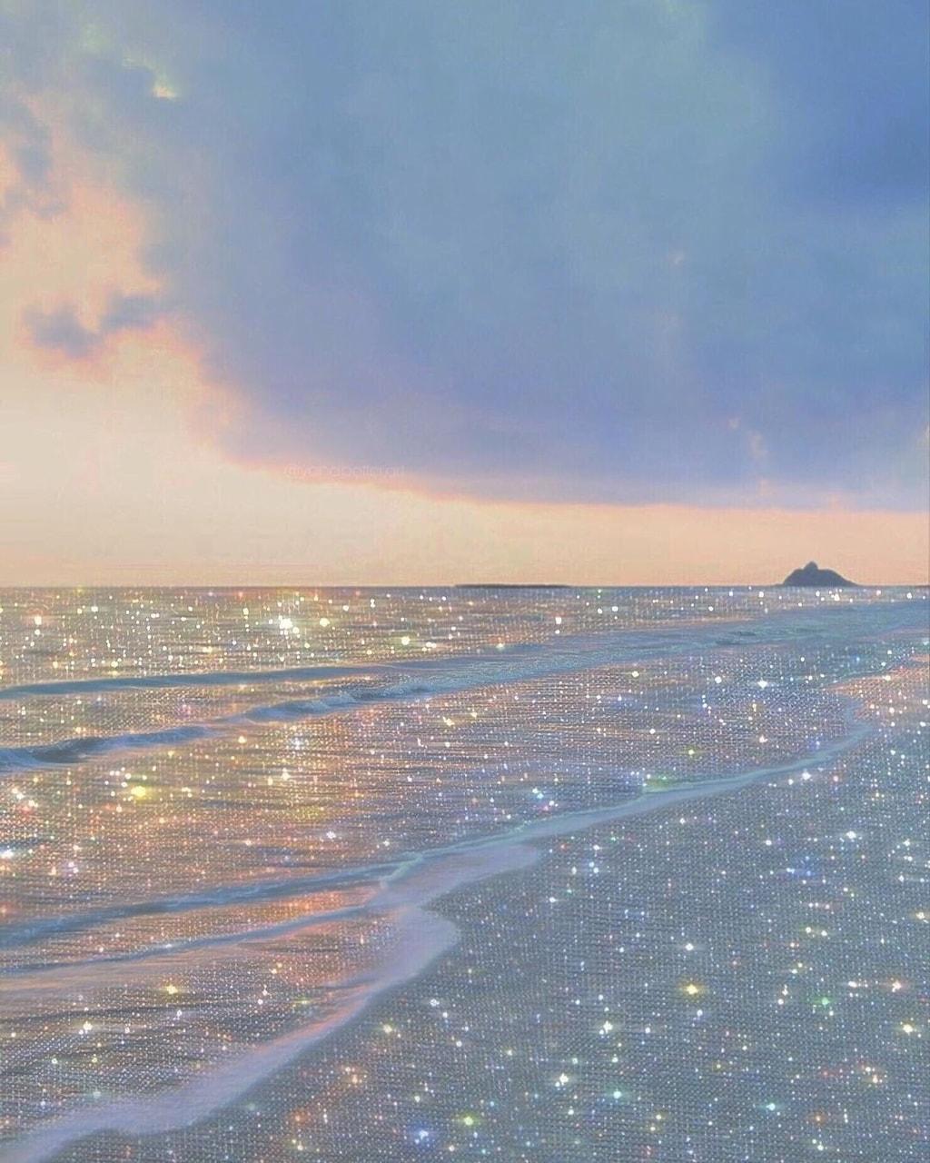 A beach with sparkling water and clouds - Bling, glitter
