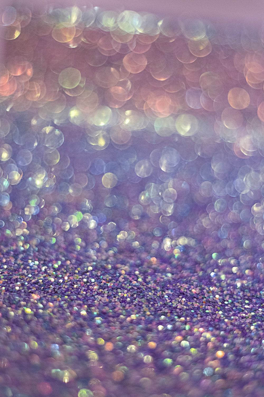 A close up of some glitter on the ground - Bling