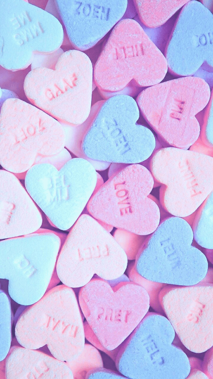 A close up of many heart shaped candy - Valentine's Day