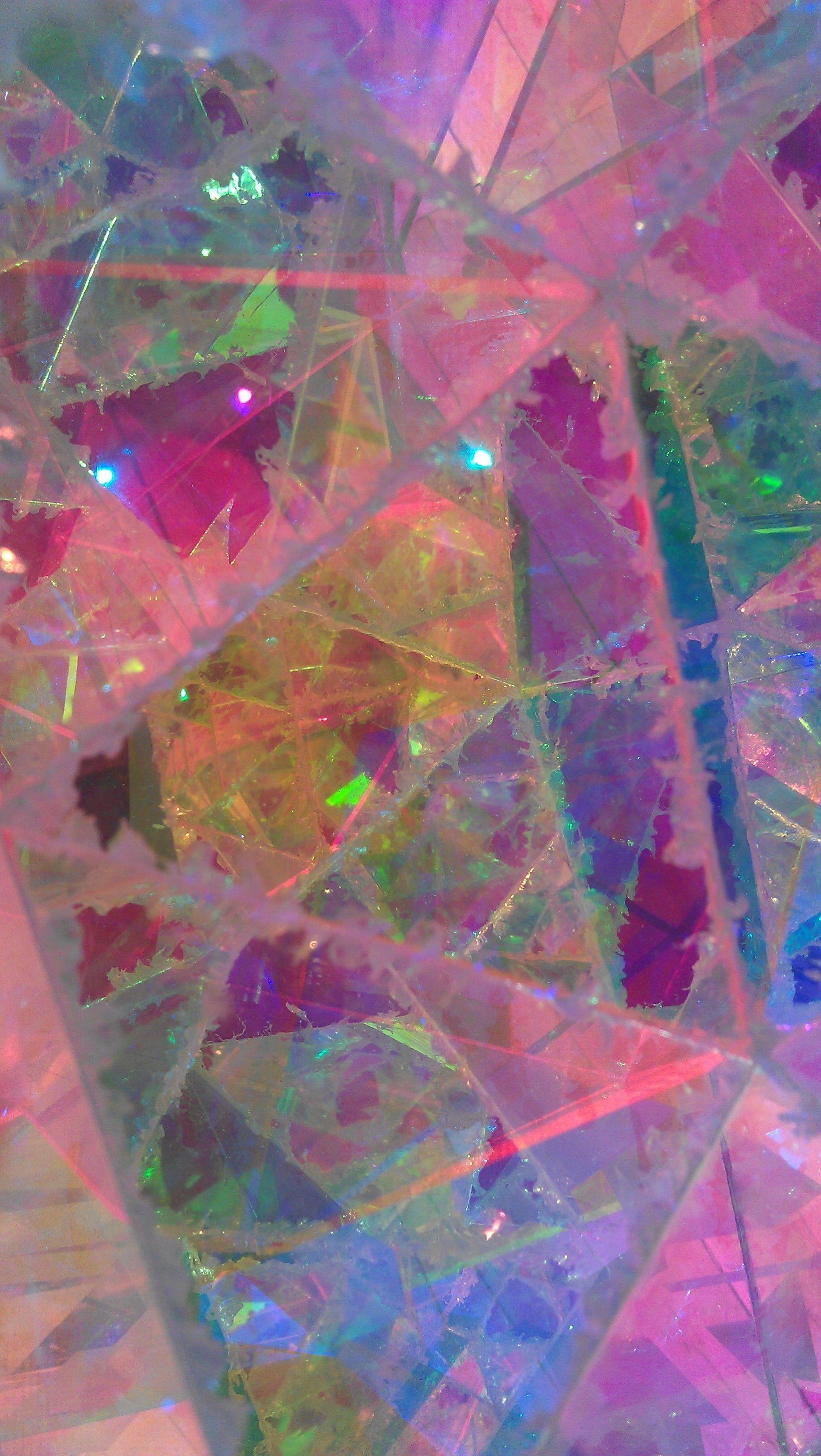 A photo of a piece of glass with a rainbow of colors. - Holographic, iridescent