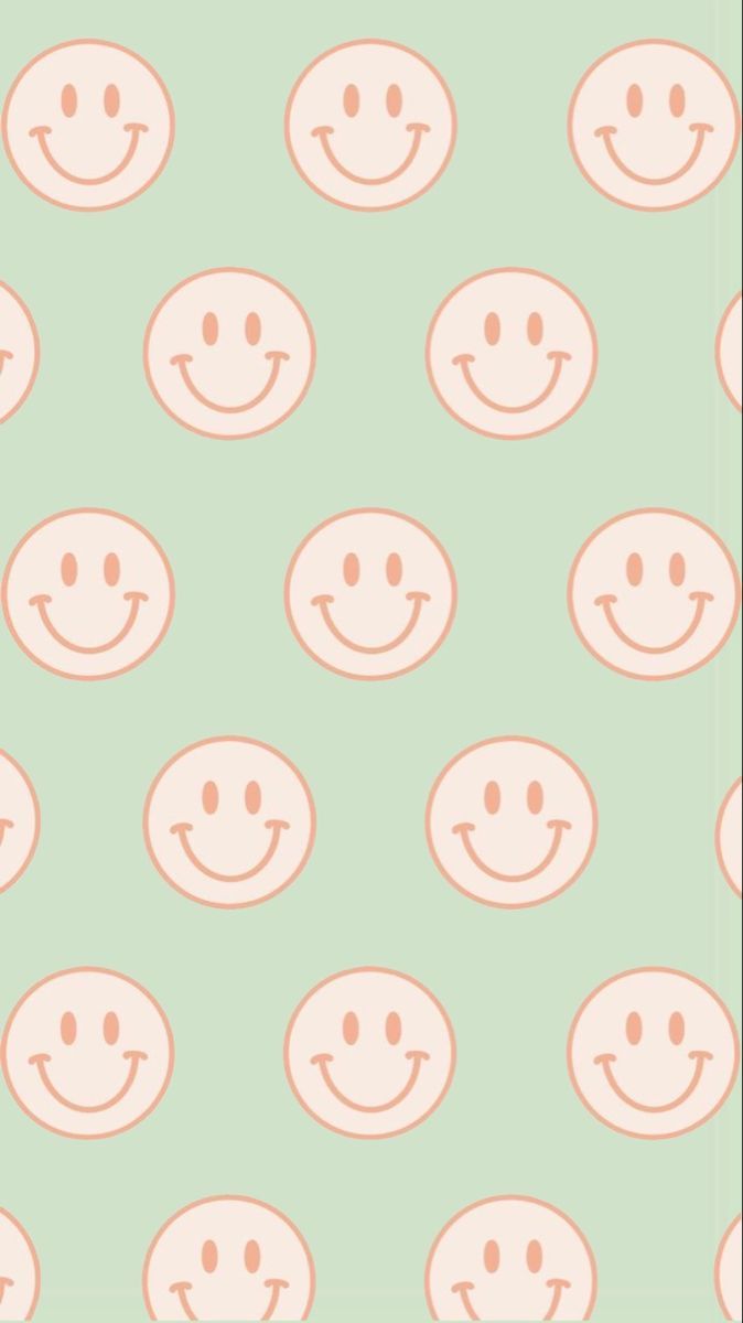 A pattern of pastel pink smiley faces on a green background - Smiley