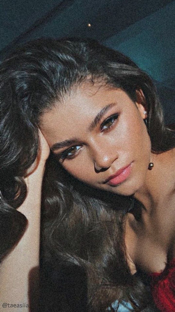Zendaya's green eyes and red lipstick are a perfect match for her red dress. - Zendaya