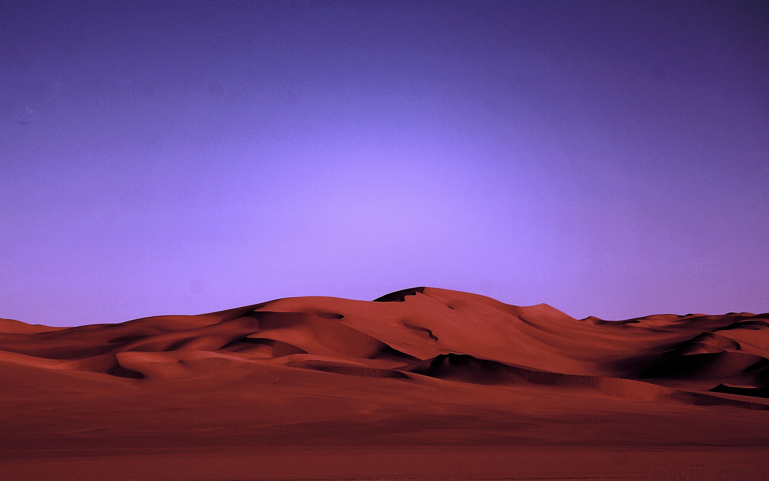 Red sand dunes under a purple sky - Desert