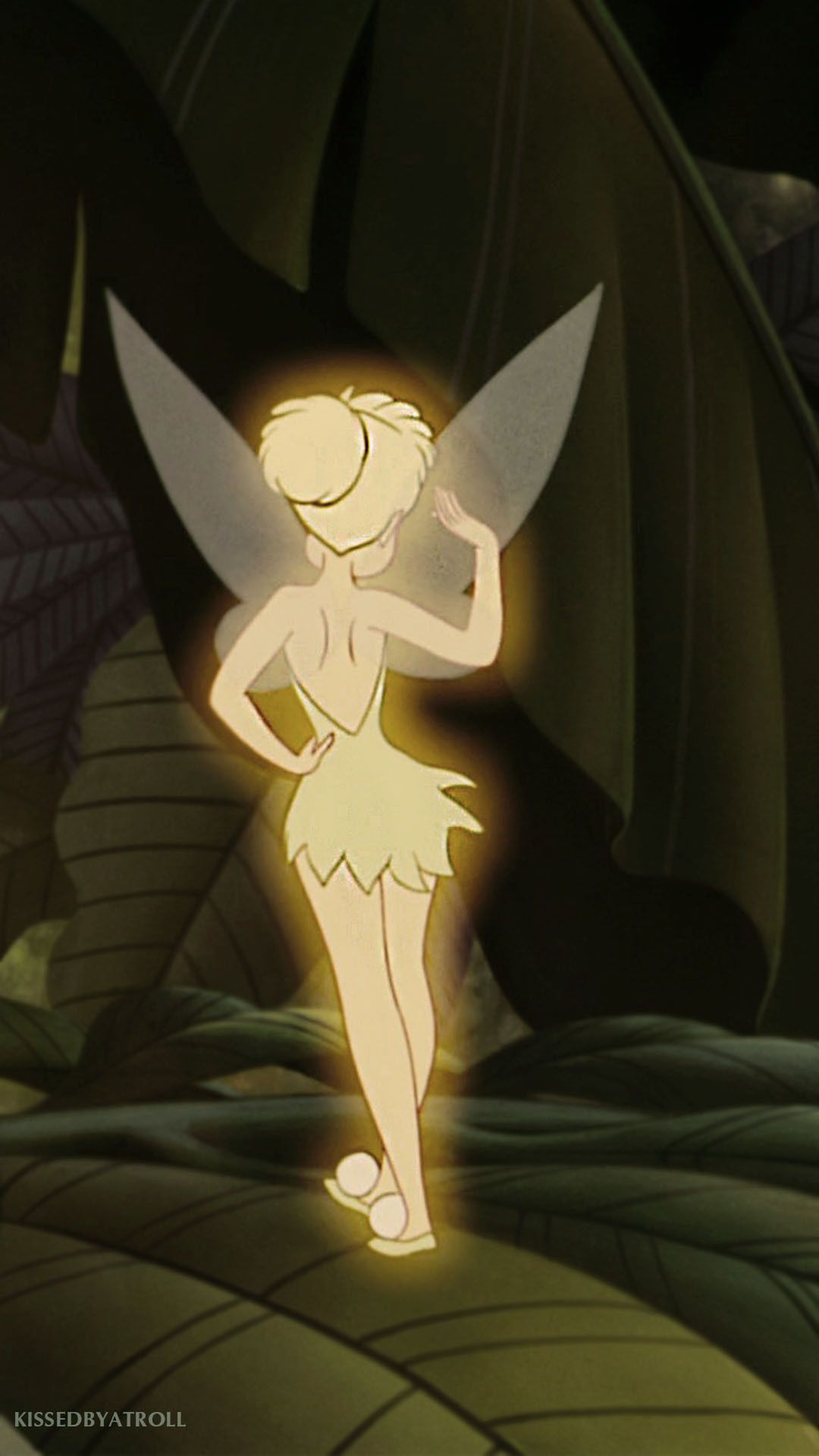 A beautiful fairy in a white dress standing on a green leaf - Tinkerbell
