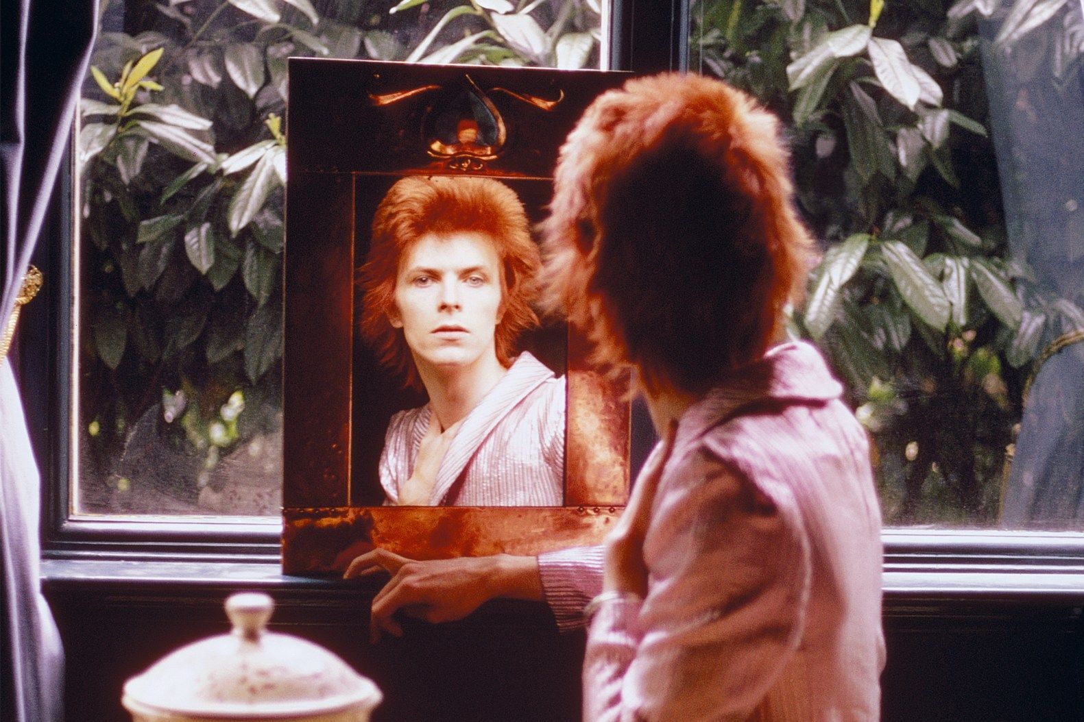 David Bowie with his face on a painting - David Bowie
