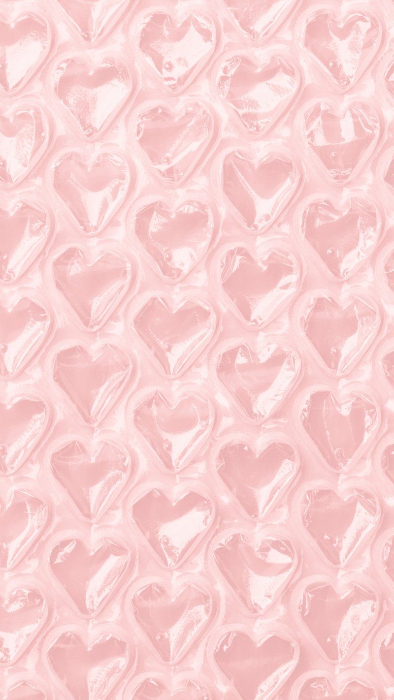 A pink background with a pattern of hearts - Pink heart