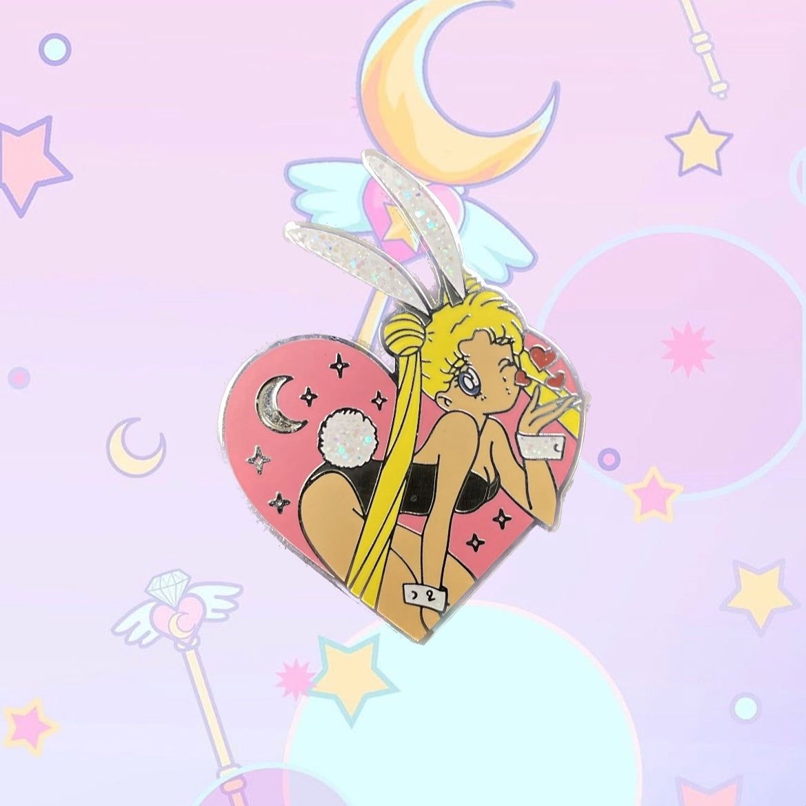 A sailor moon enamel pin with a heart shaped background - Sailor Moon