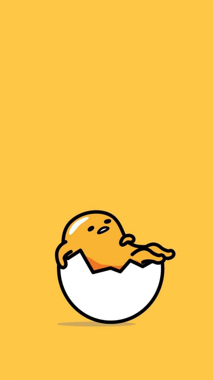 A picture of a yellow egg with a face and arms, cracked open and revealing a yellow egg inside. - Egg, Gudetama
