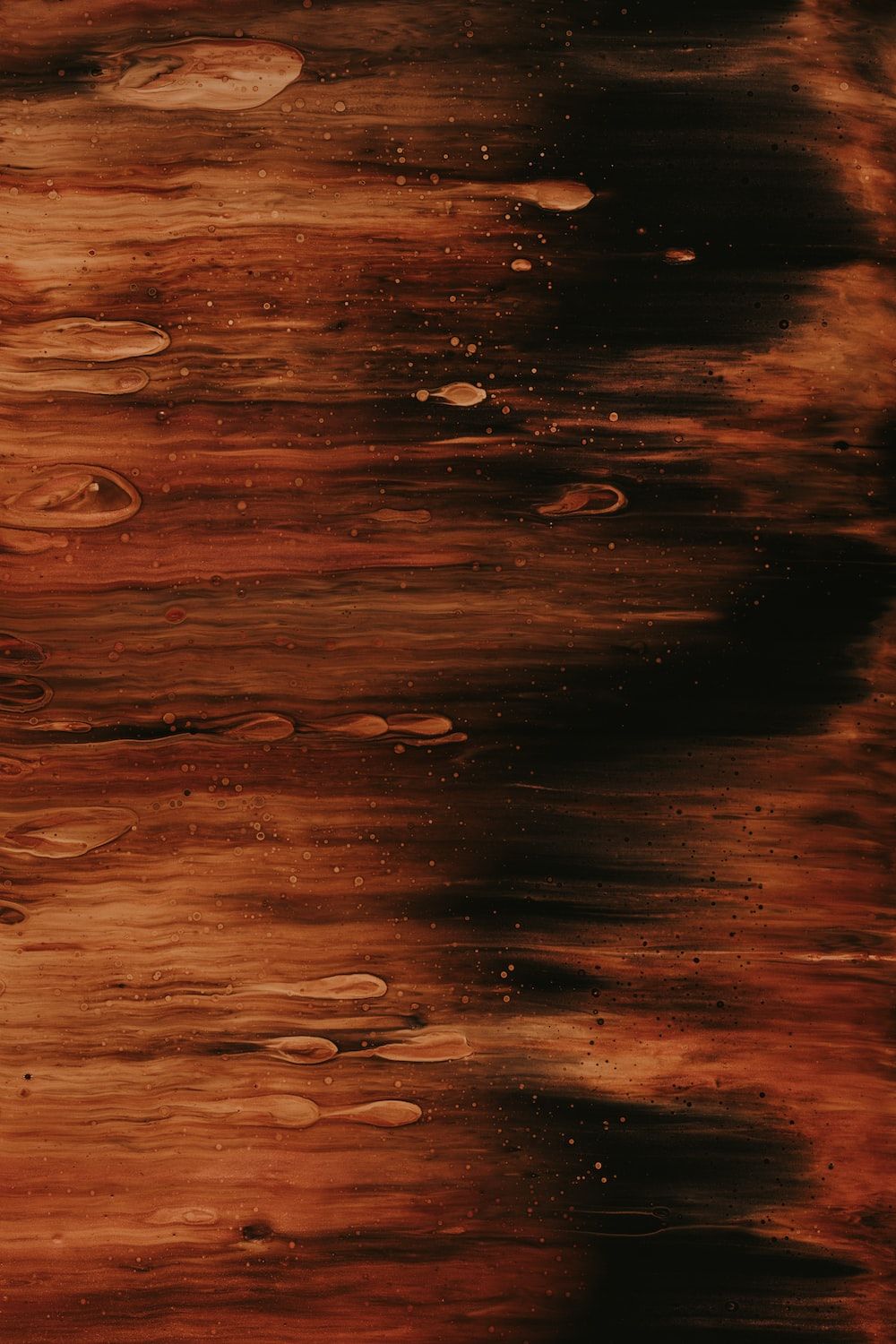 A close up of a black and orange picture. - Dark orange
