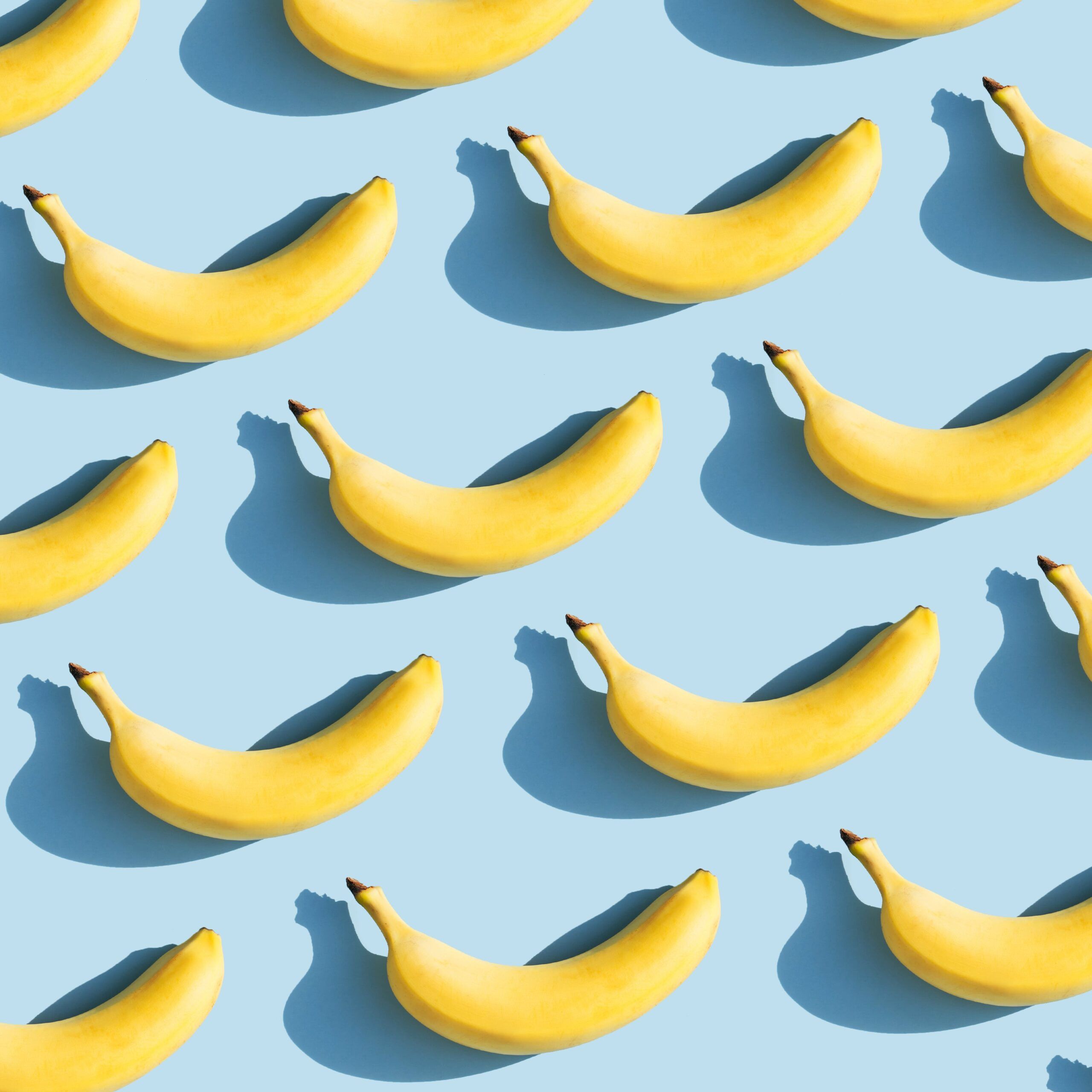 A blue background with yellow bananas - Banana