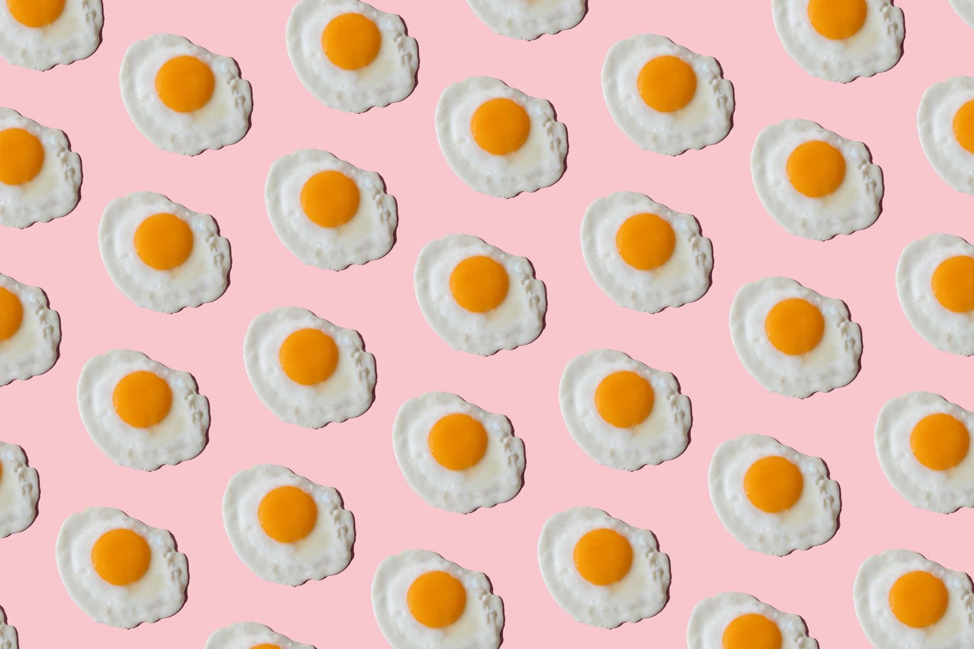 A pattern of fried eggs on a pink background - Egg