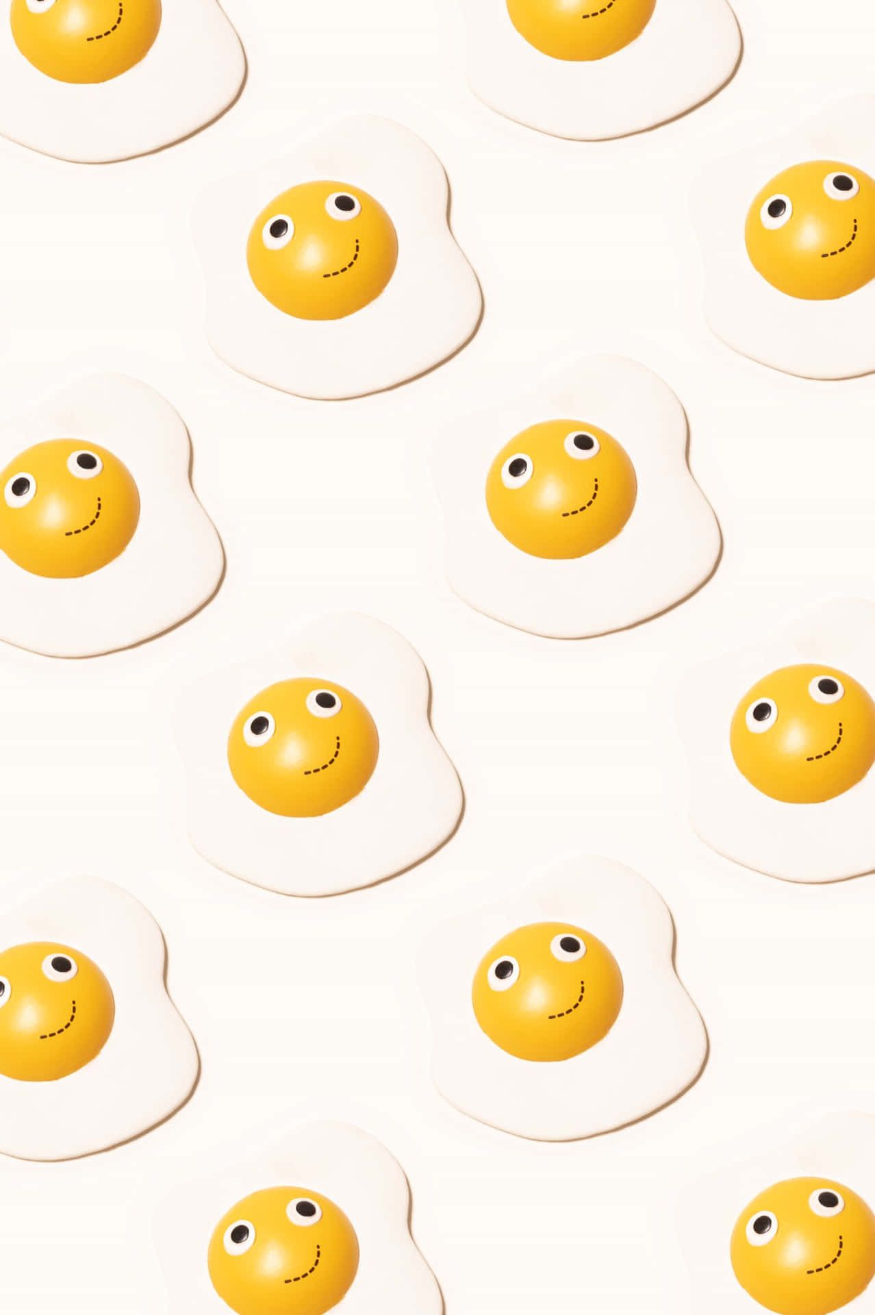 Download Caption: A Lively Smile Emoji Blended with Sunny Side Up Egg Wallpaper