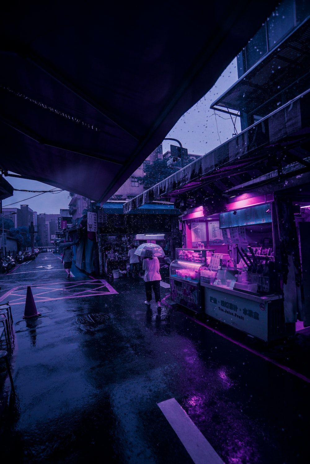 Purple neon lighted store beside person holding umbrella - Cyberpunk 2077