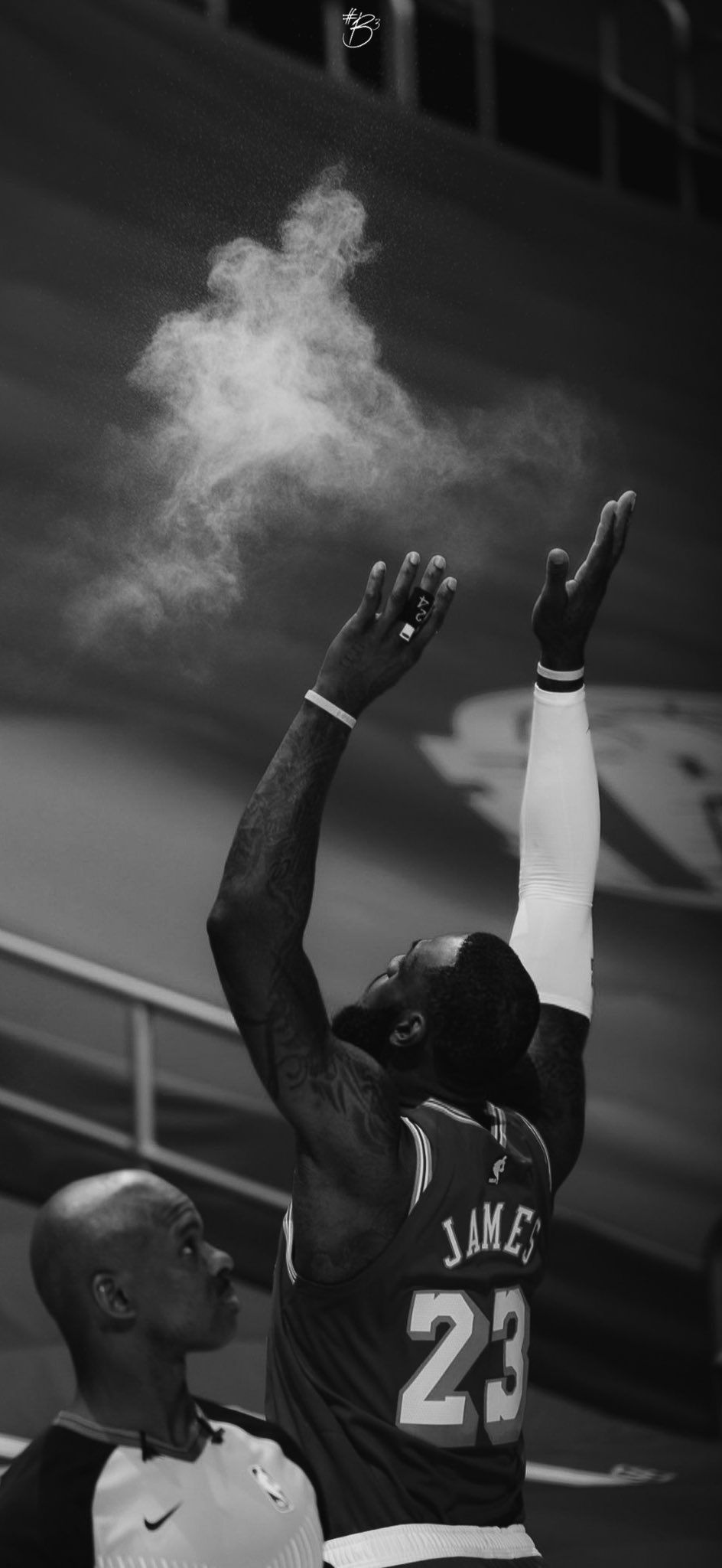 A black and white photo of LeBron James taking a jump shot. - Lebron James