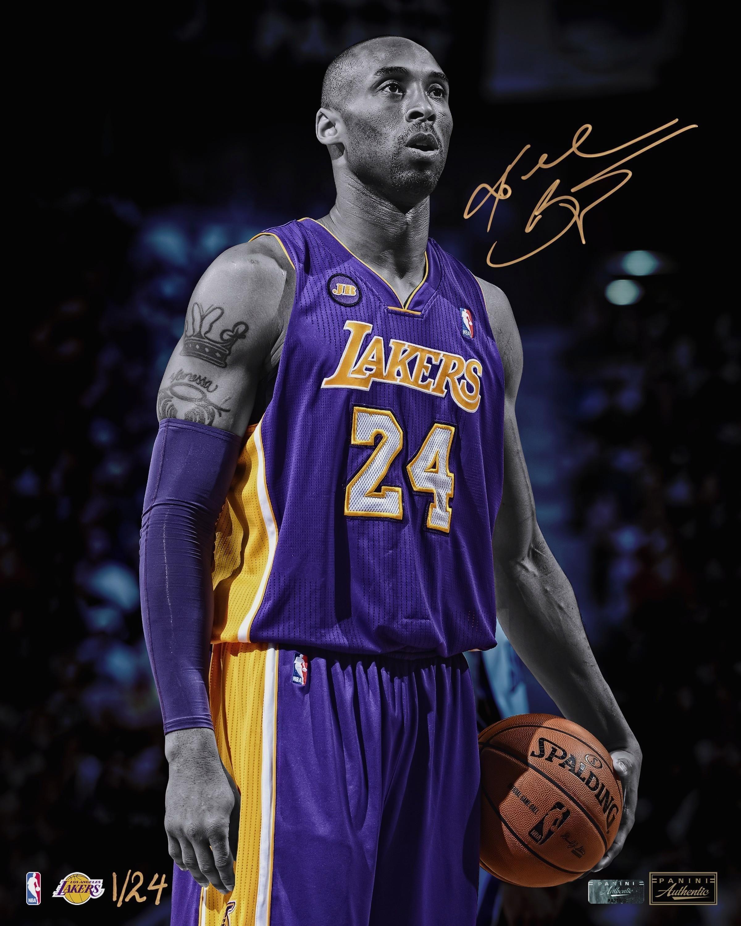 Kobe Bryant, the Lakers' retired basketball player, holding a basketball. - Kobe Bryant