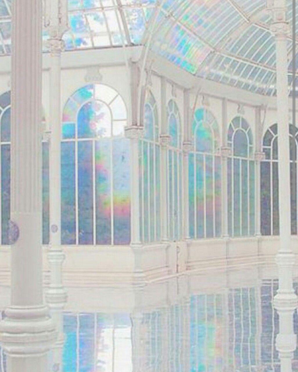 A white greenhouse with rainbow glass and a reflective floor - Holographic