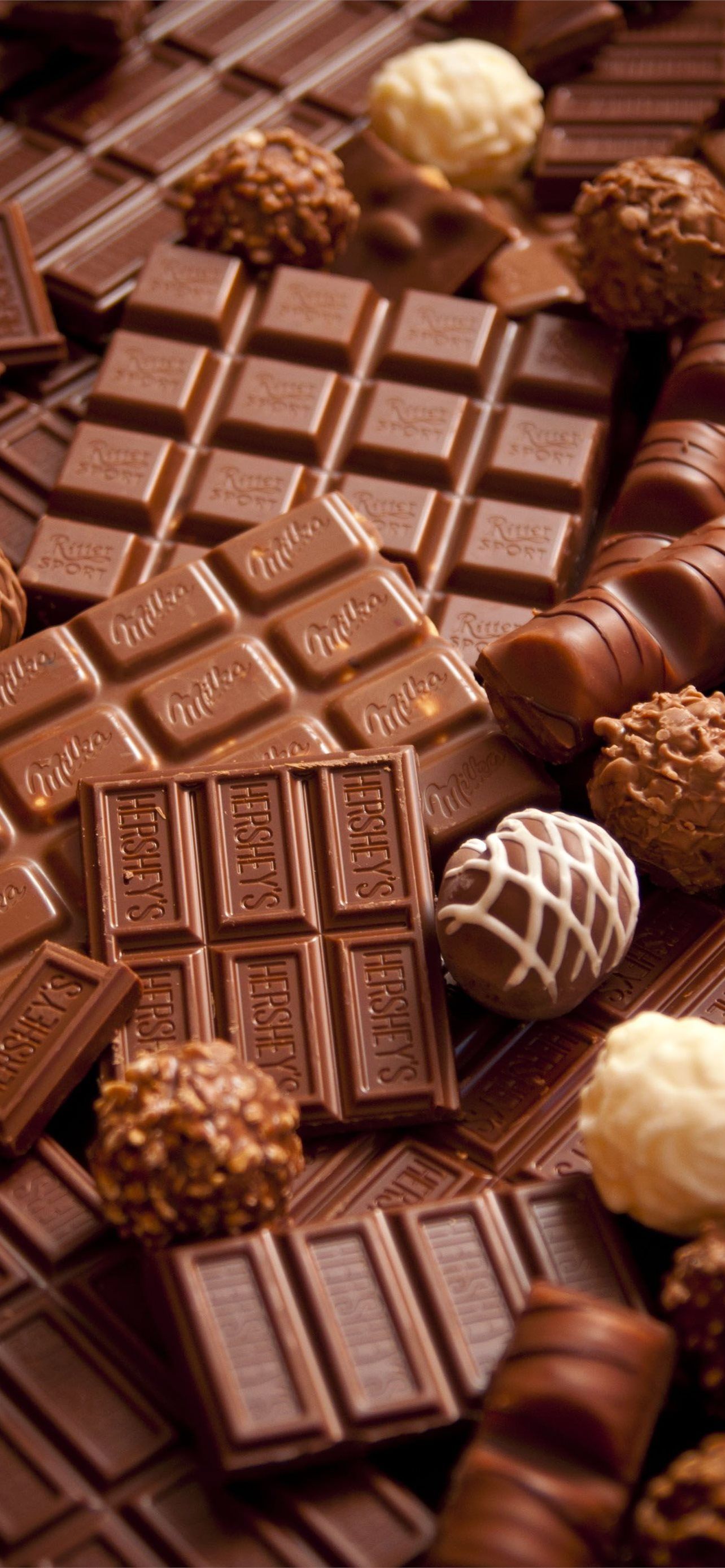 A close up of chocolate bars and other candy - Chocolate