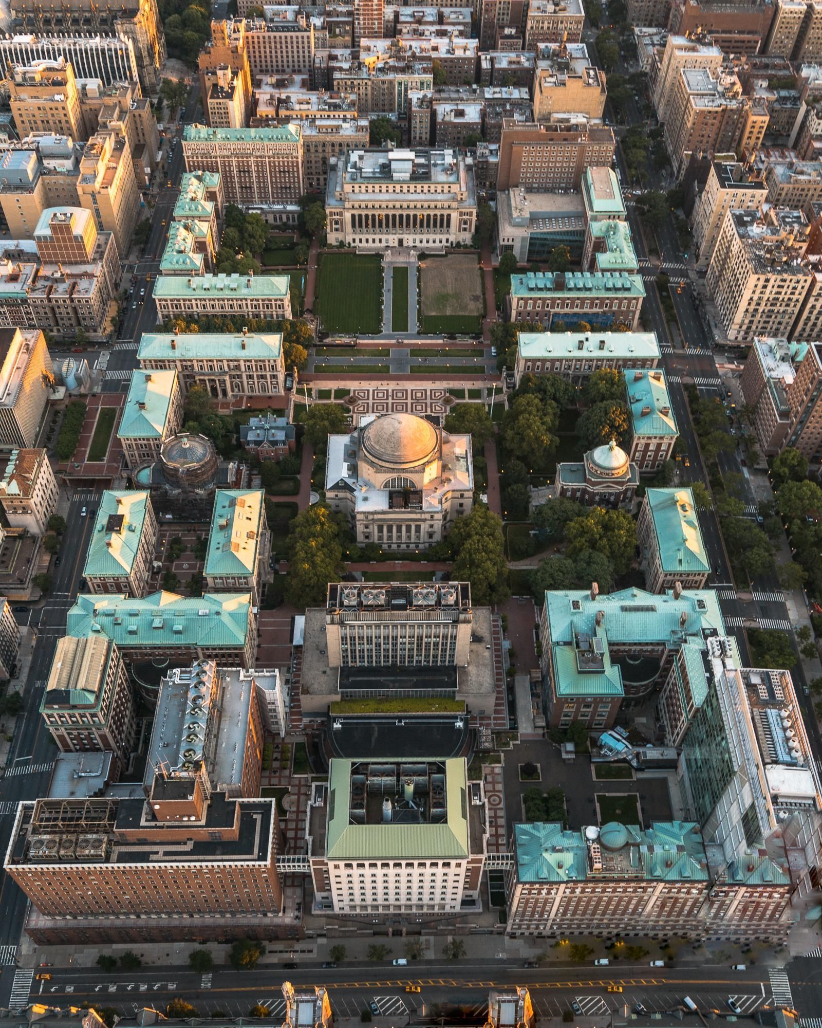 Aerial view of a large university campus with a dome centered in the middle. - Columbia University