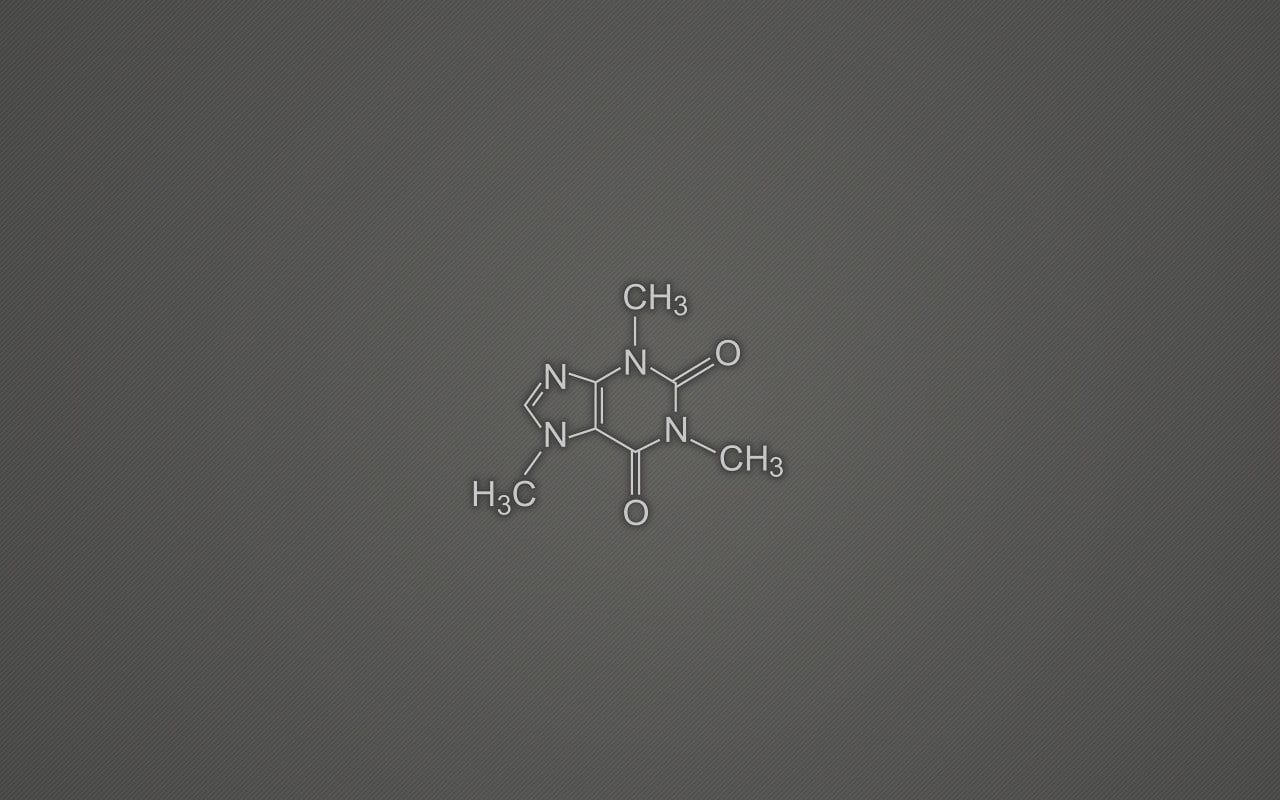Chemical formula of caffeine on a grey background - Chemistry
