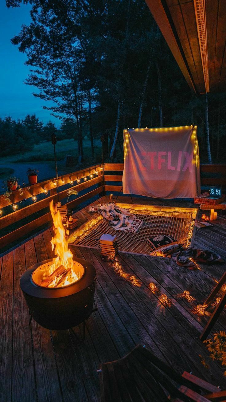 A fire pit and chairs on the deck - Camping