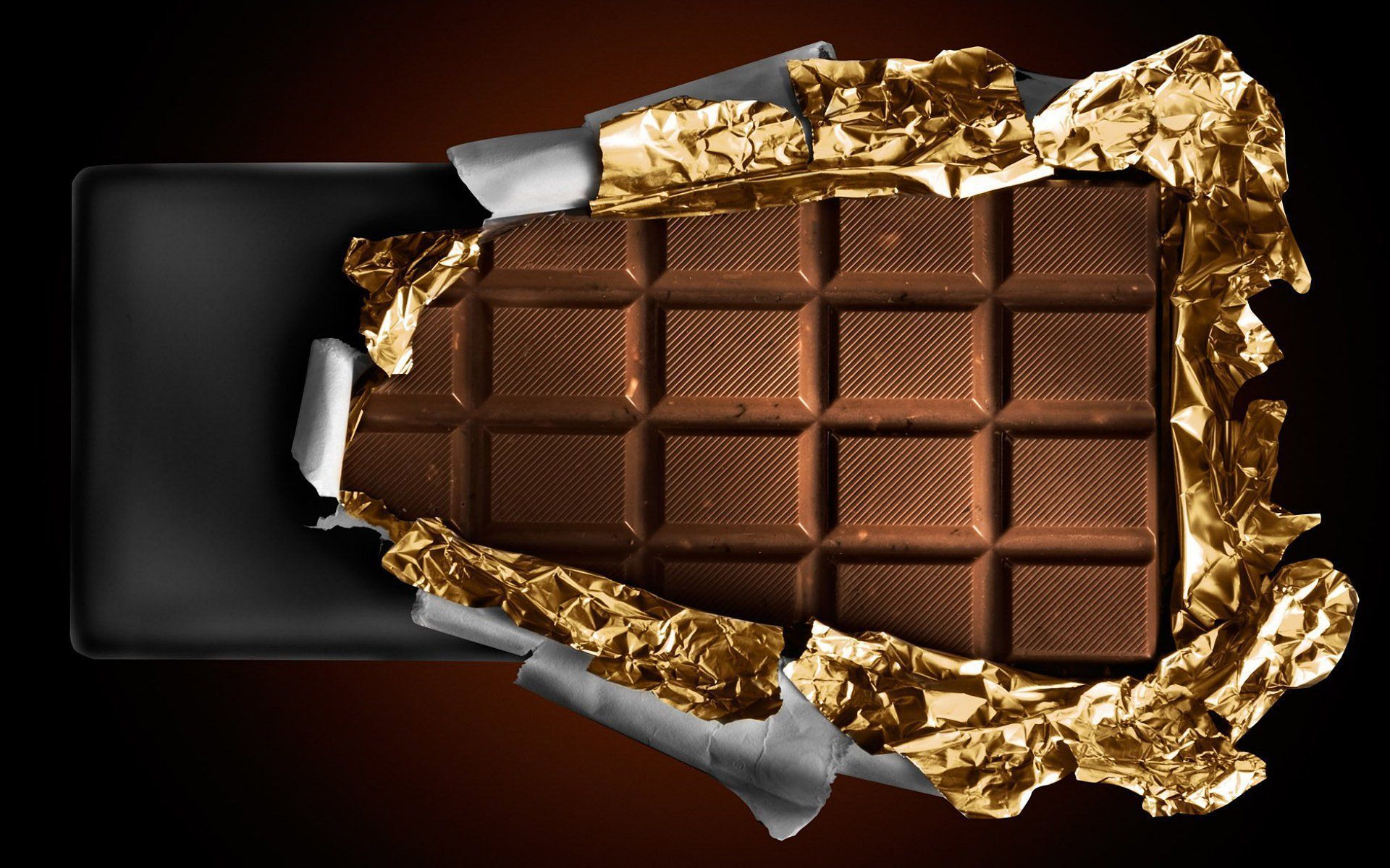 A chocolate bar with gold foil on it - Chocolate