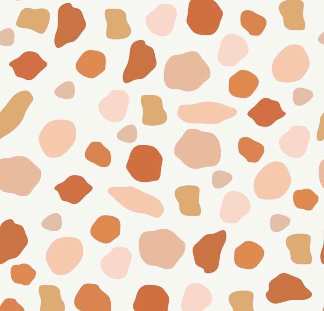 A pattern of orange and pink terracotta-like shapes on a white background - Terrazzo