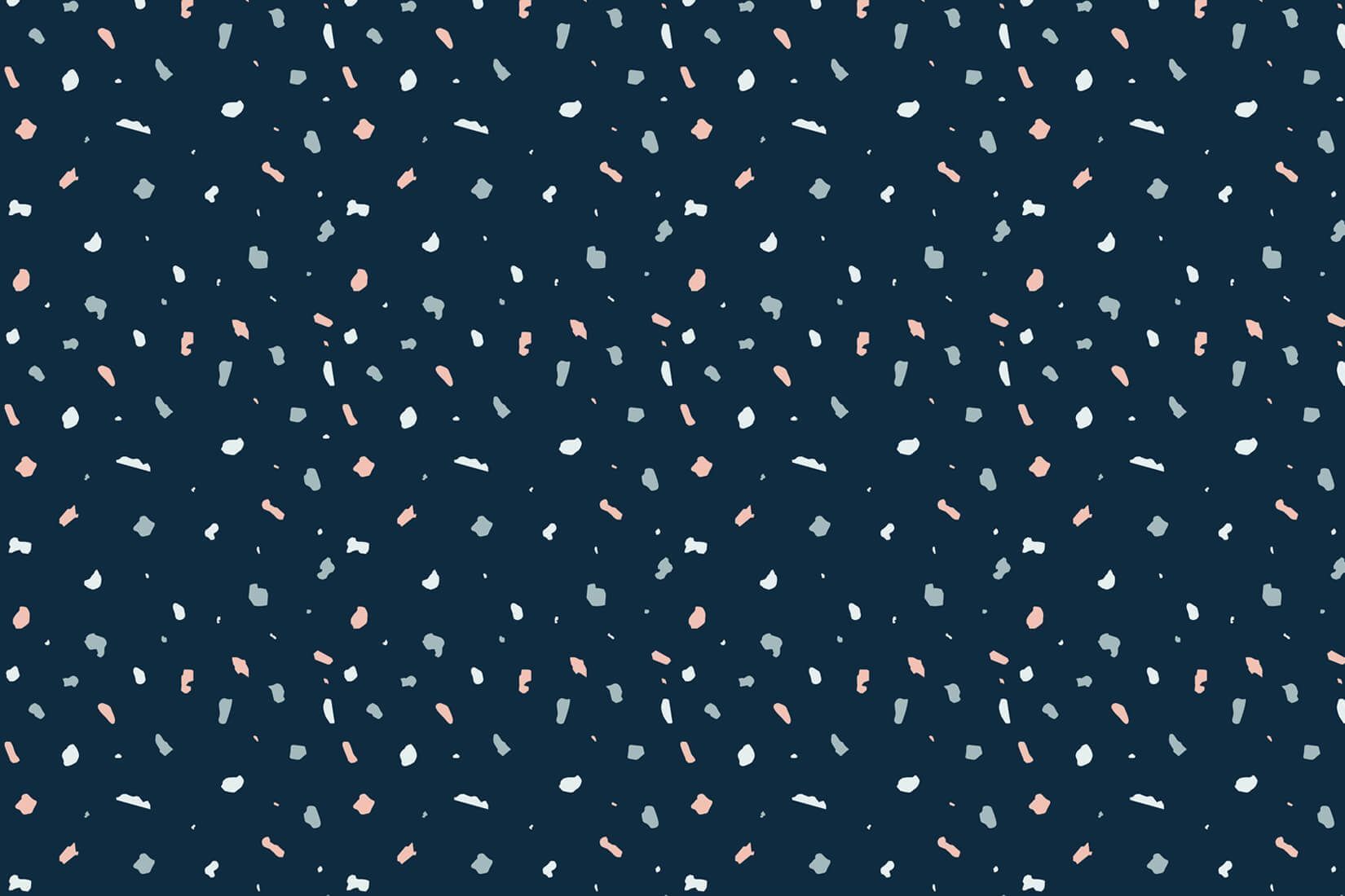 A navy blue background with a terrazzo pattern of pink, white and pale blue. - Terrazzo