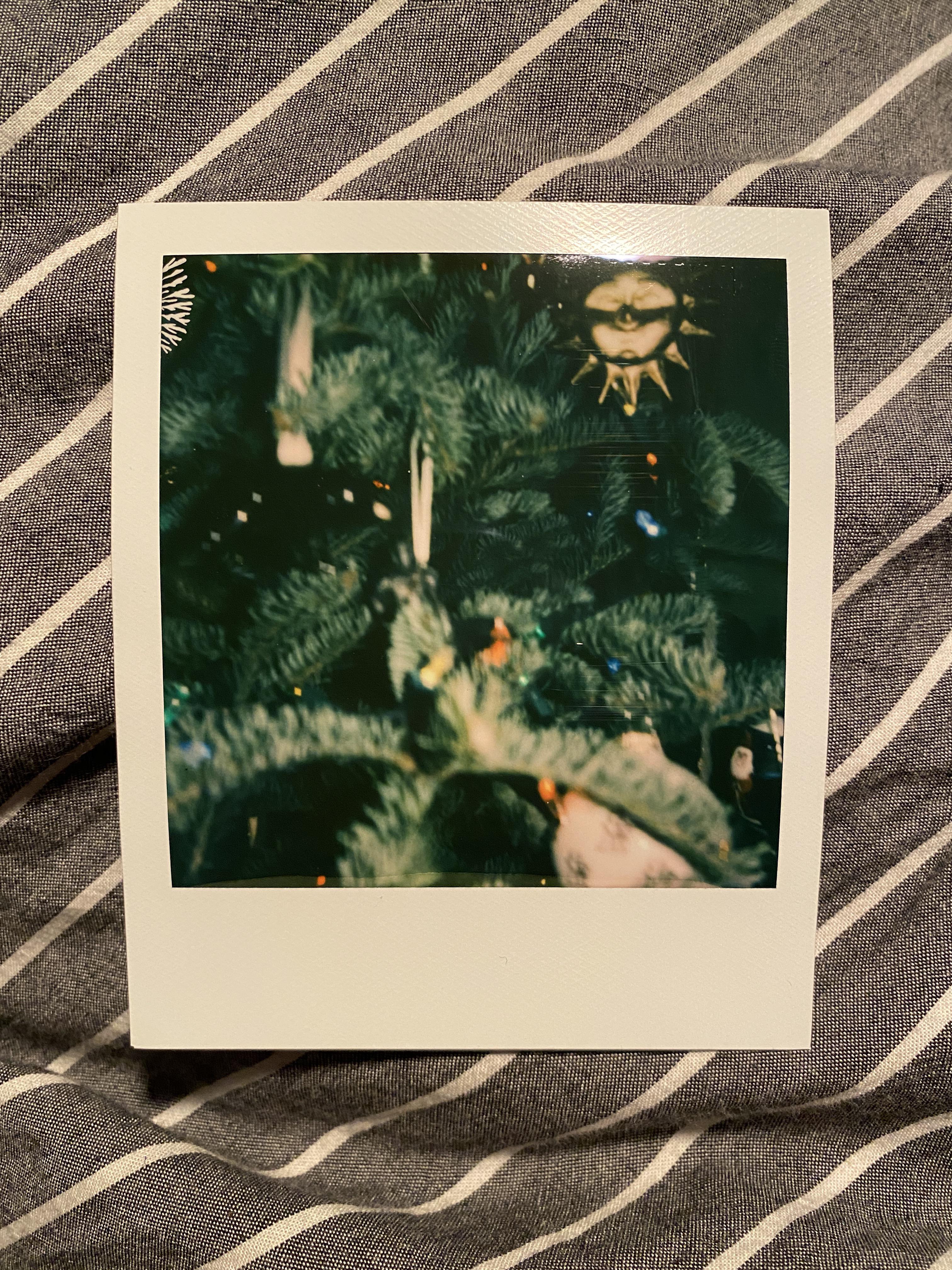 Just got a new Polaroid Now for Christmas, but keep getting this “sparkle” in the top left corner of photo. It happens regardless of film pack, and I've cleaned the rollers