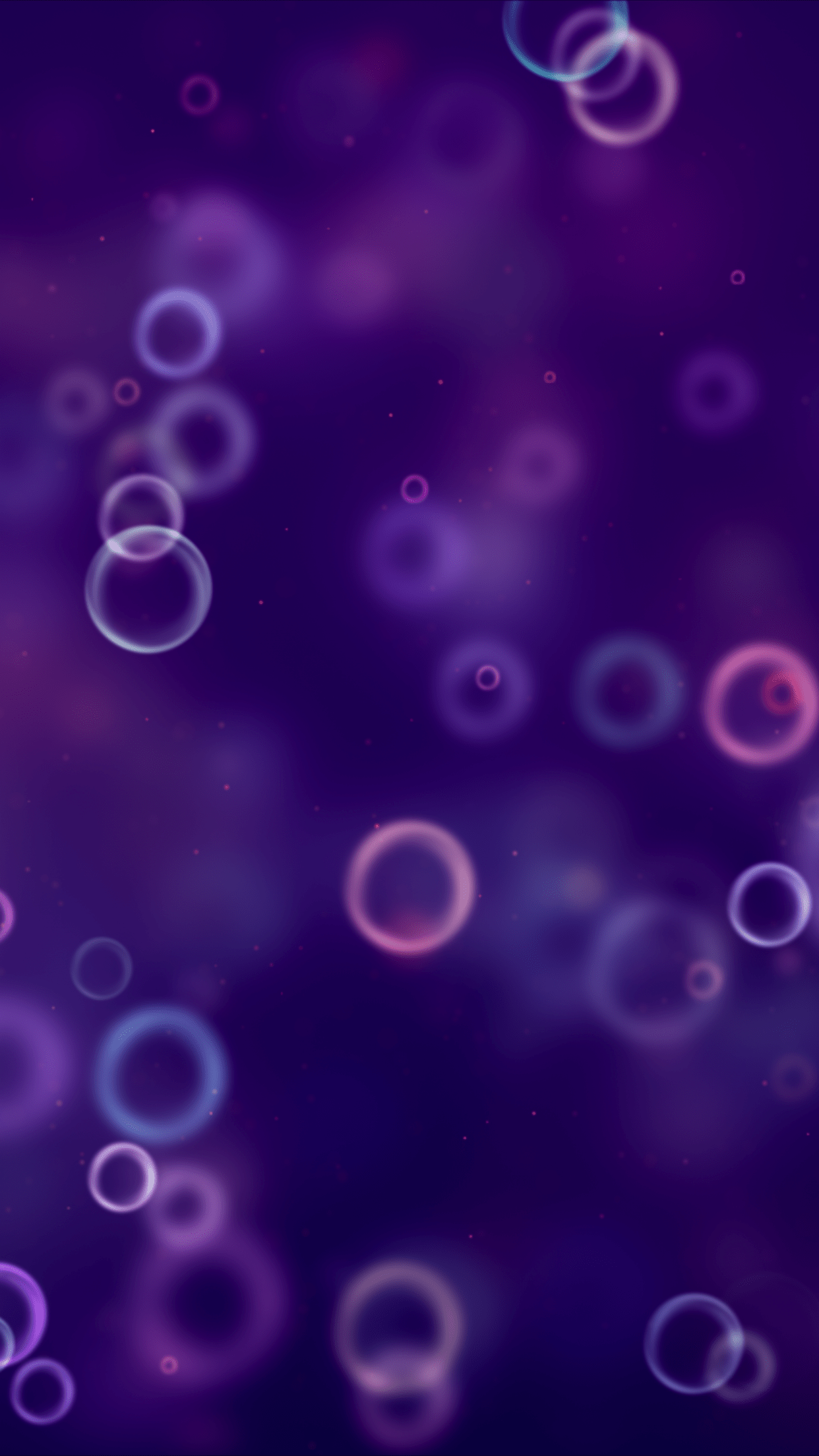 A purple image with pink and blue circles of different sizes - Bubbles