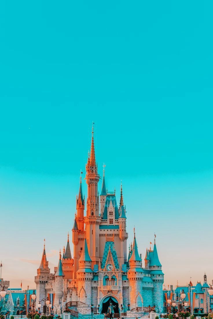 The iconic Disney castle against a blue sky - Castle