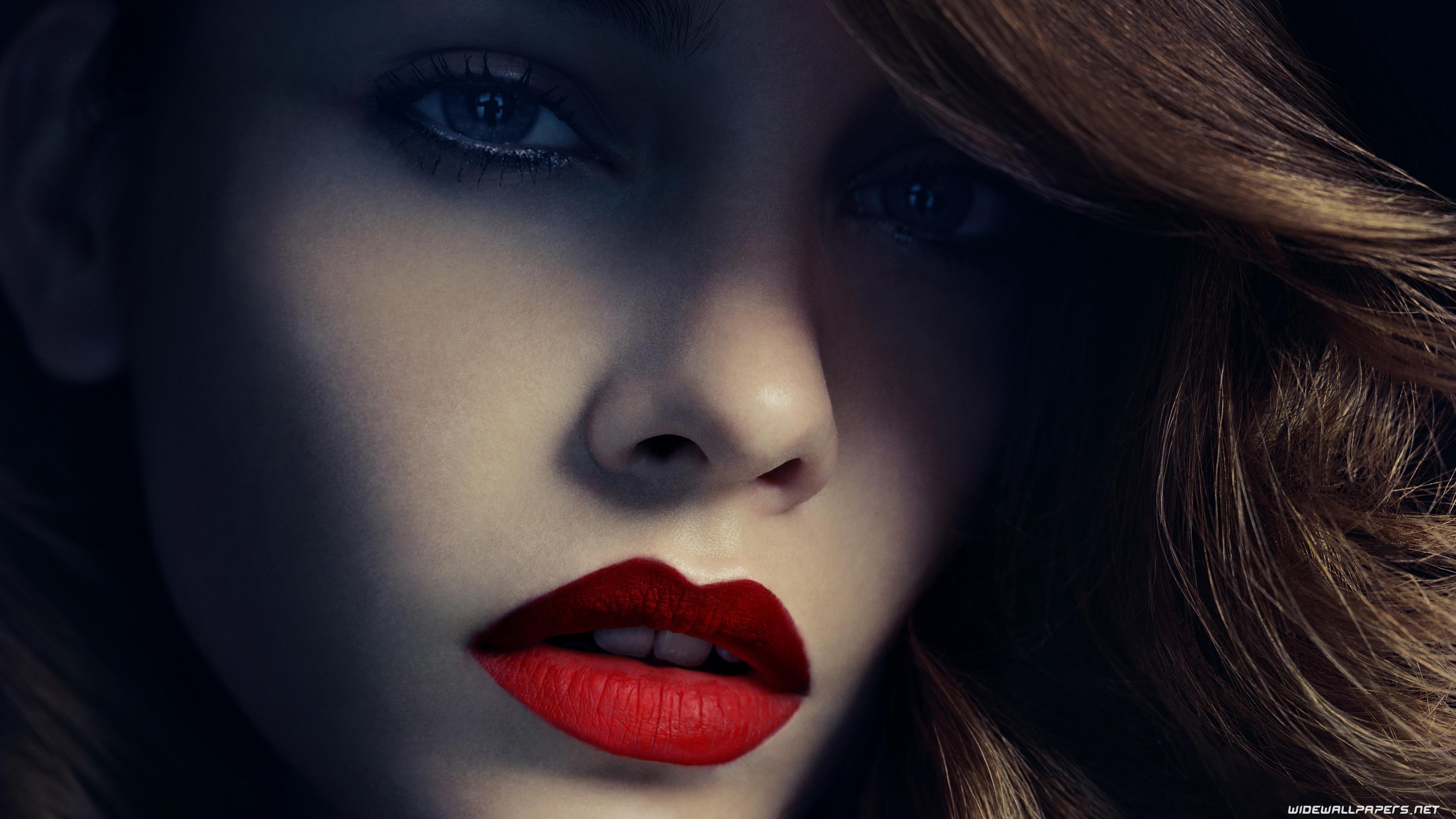 Close up of a woman with red lipstick - Crimson