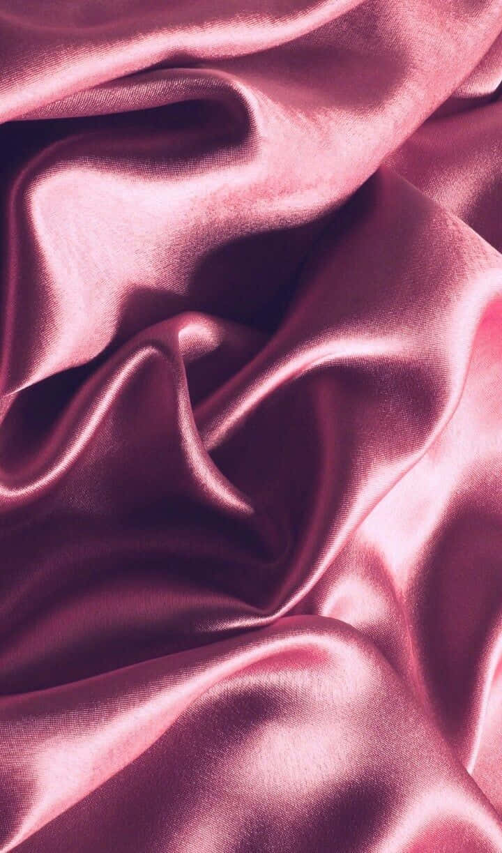 A close up of a pink silk fabric - Silk