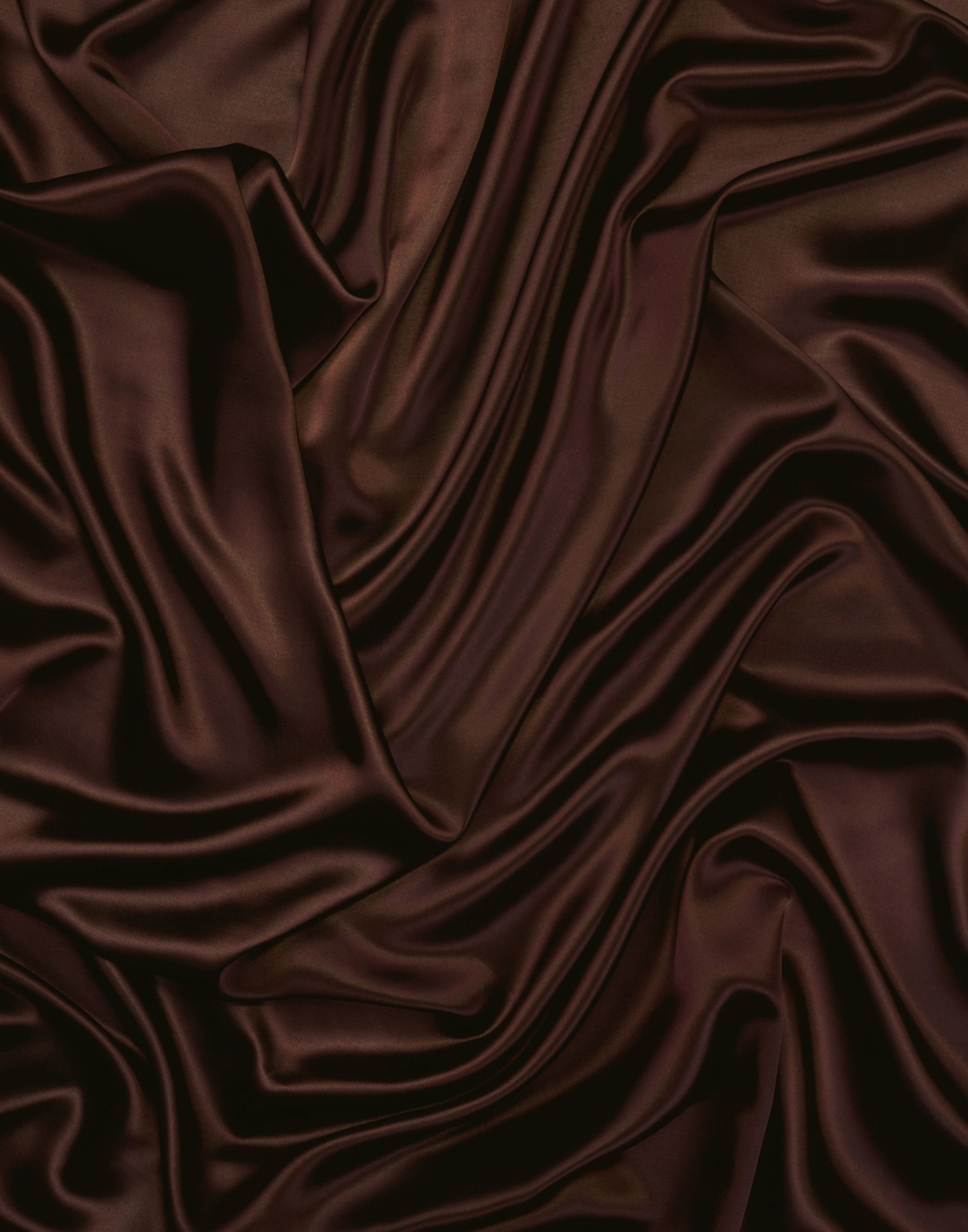 A close up of a dark brown silk material - Silk