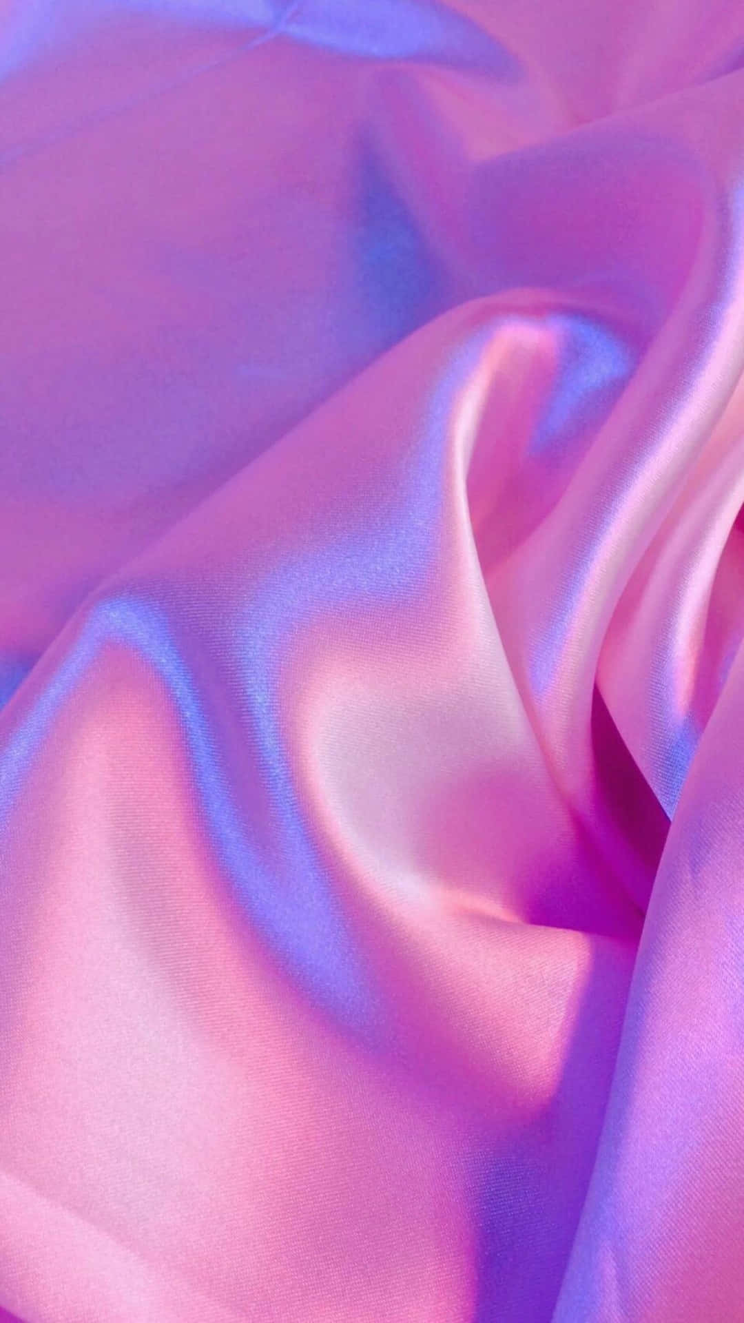 Download A Close Up Of A Pink And Blue Satin Fabric Wallpaper