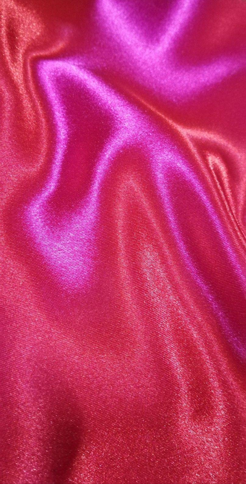 A close up of a pink and purple metallic fabric. - Silk