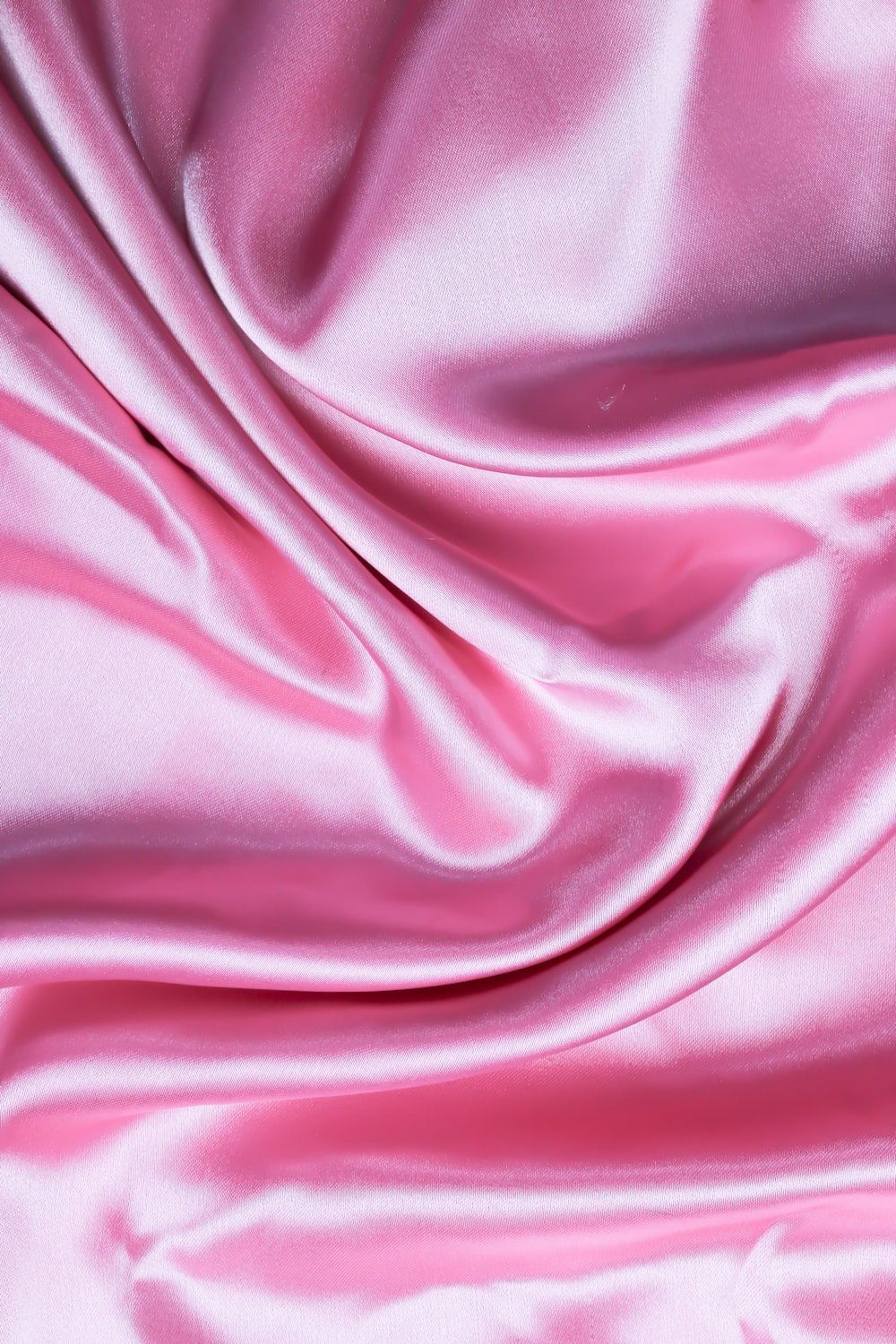 A close up of a pink silk material - Silk