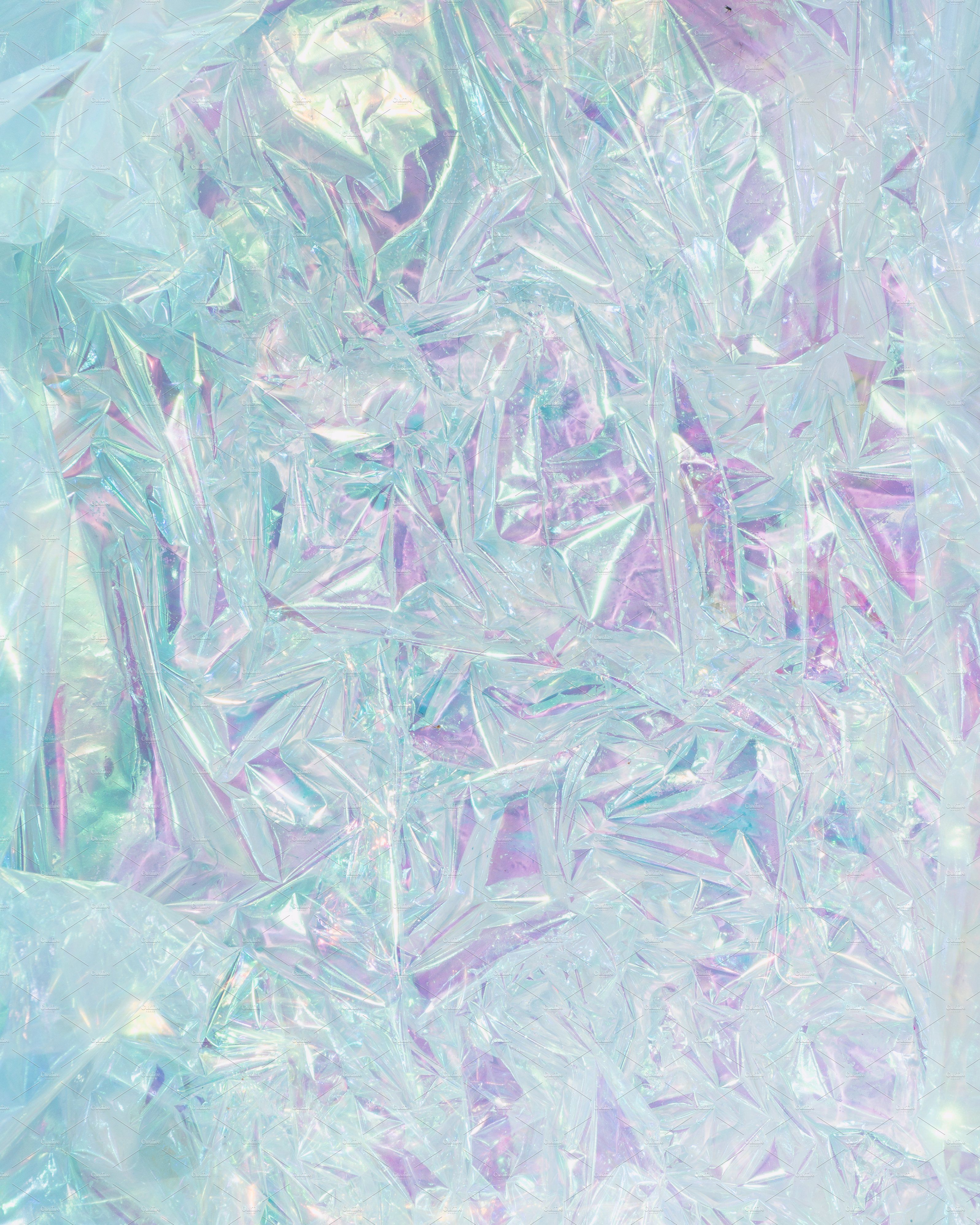 A blue and purple iridescent crumpled foil background - Iridescent, holographic