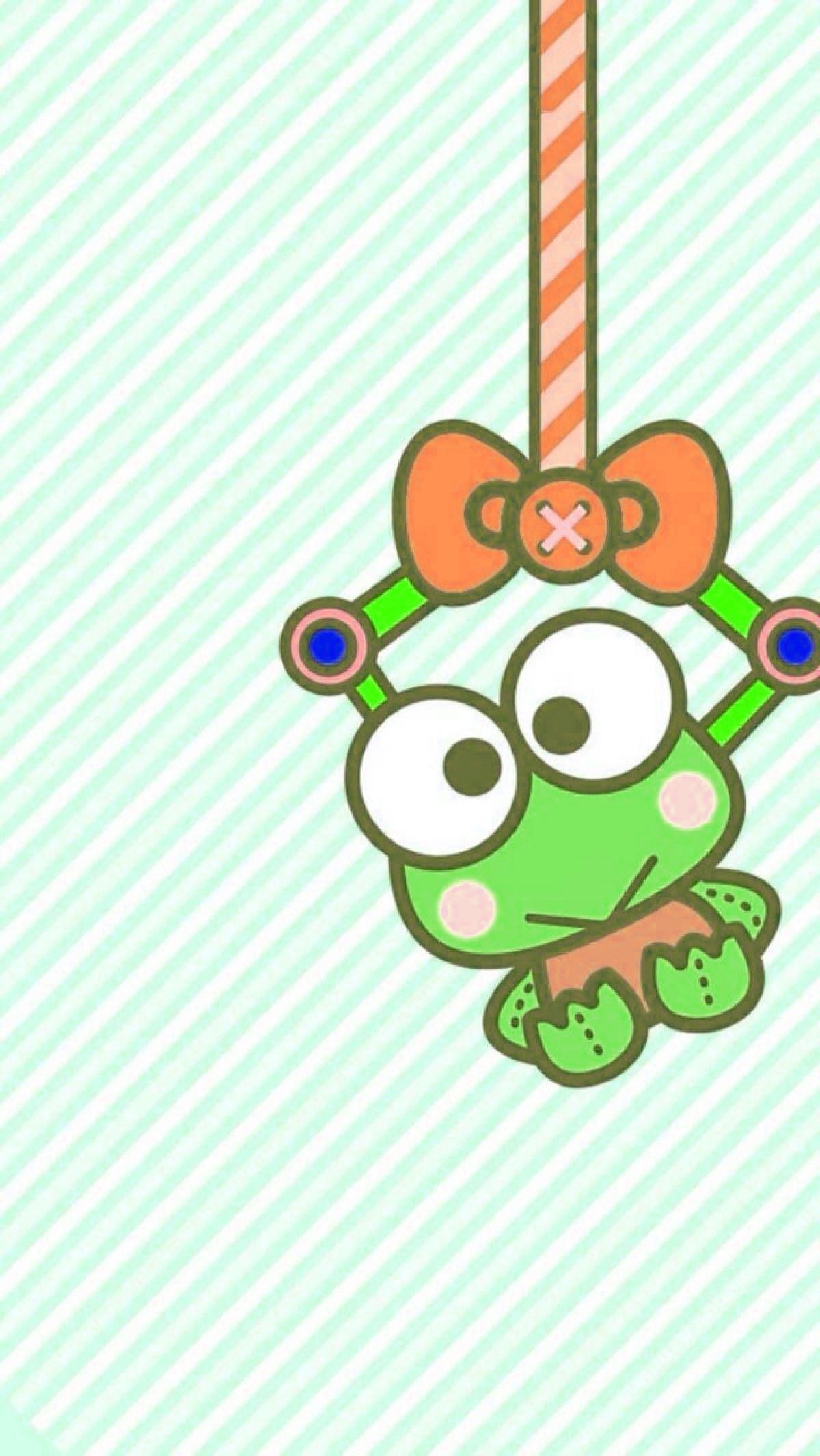 Keroppi, the cute green frog from Sanrio, hanging from a ribbon. - Keroppi