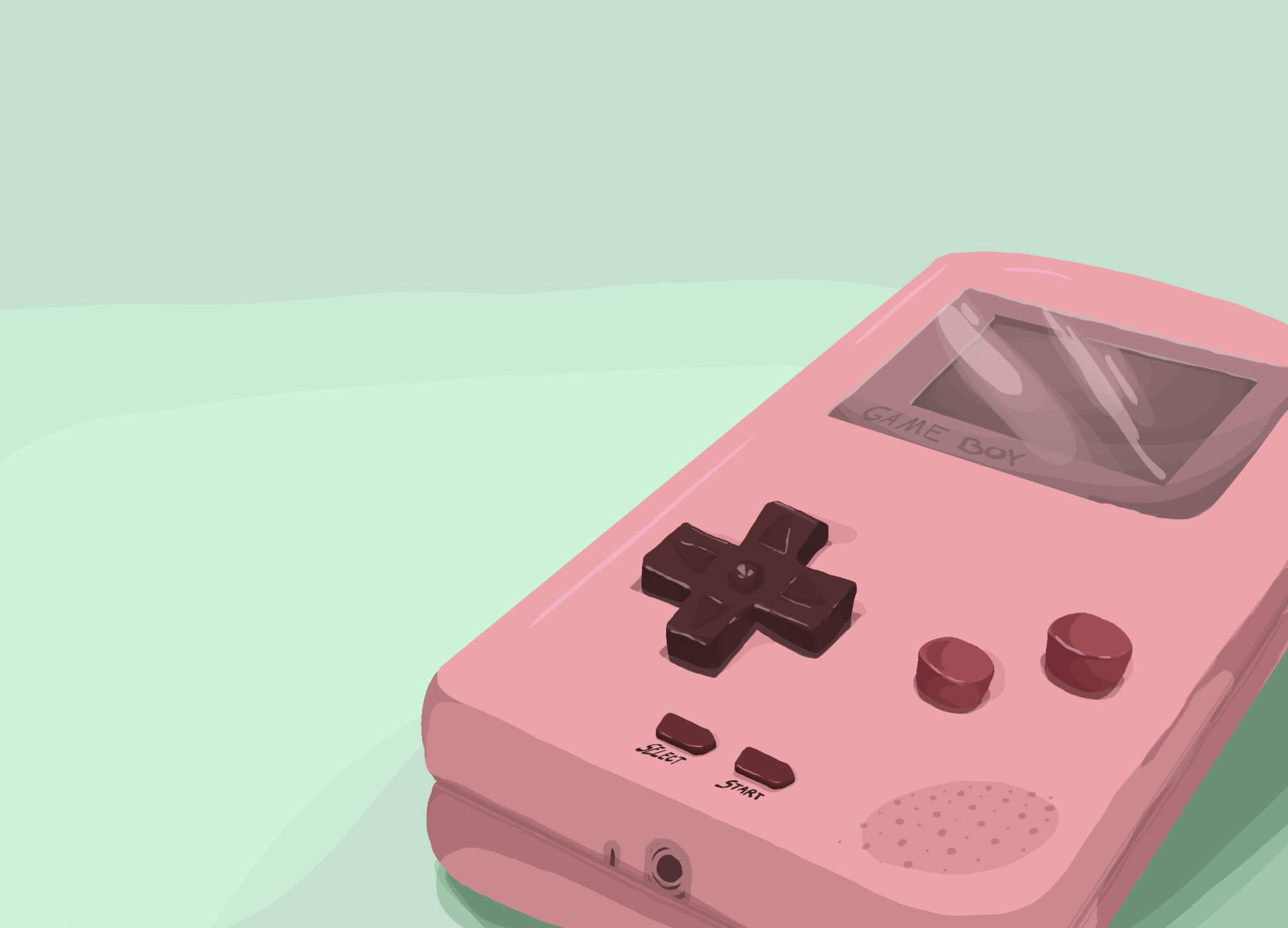 A pink Gameboy sitting on a green table. - Game Boy