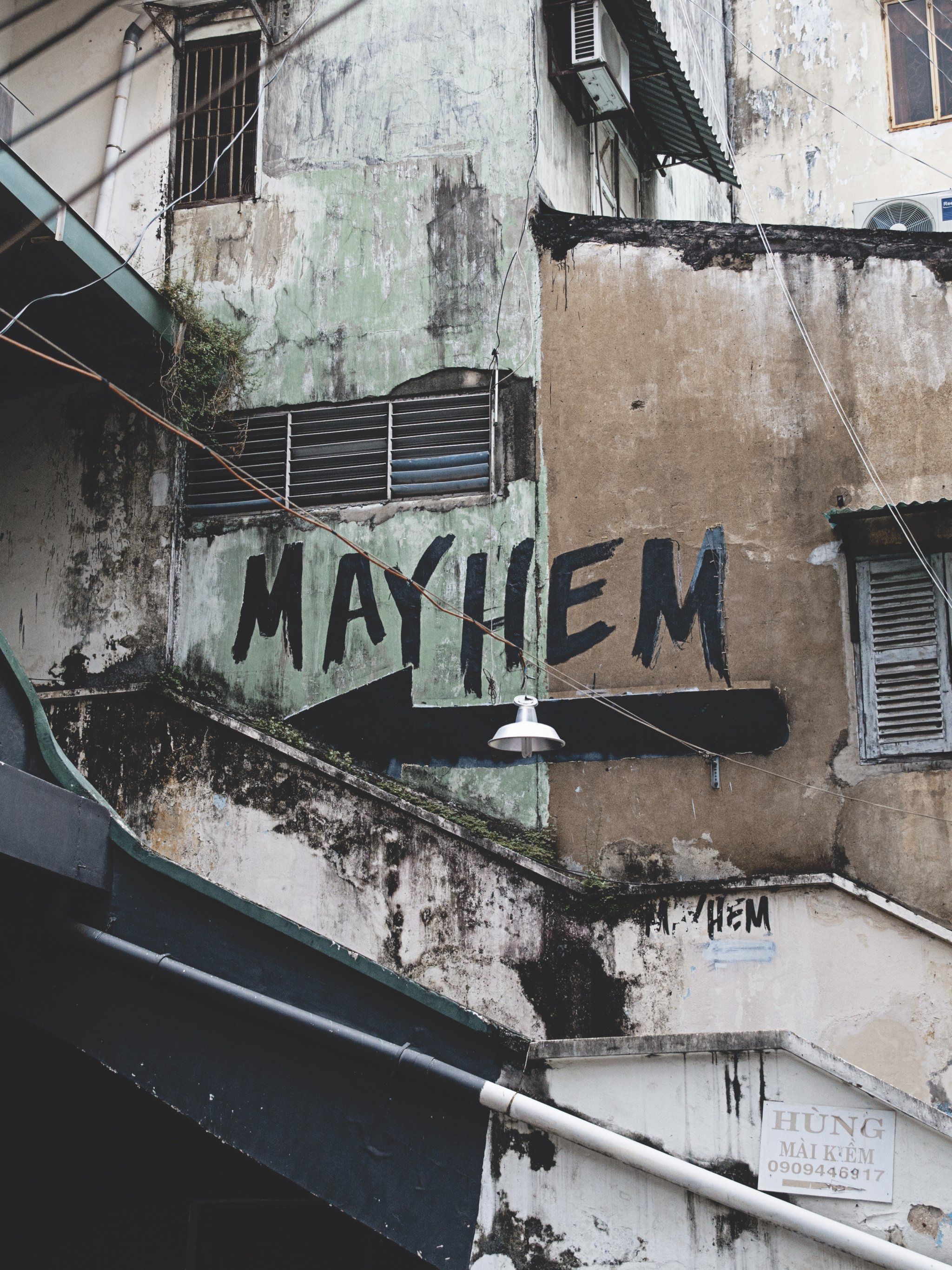 A wall with the word Mayhem written on it - Graffiti