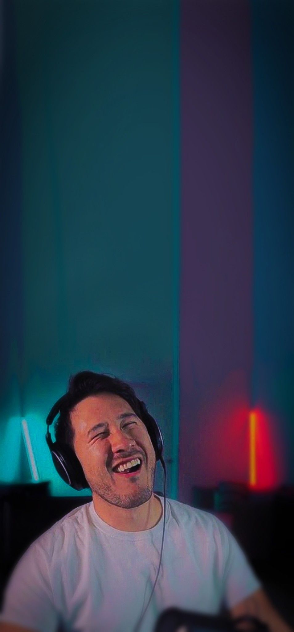 A man wearing headphones and laughing - Markiplier