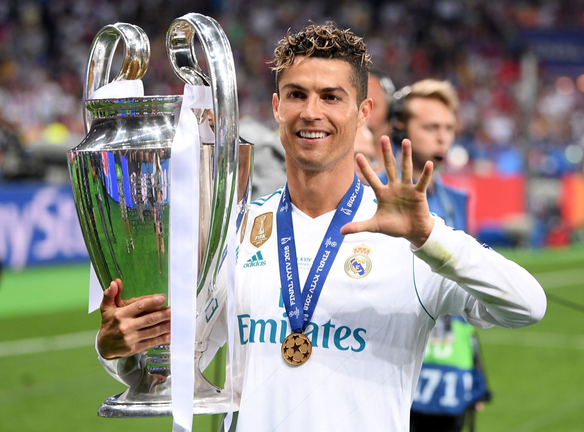 Cristiano Ronaldo holding the champions league trophy and wearing his gold medal - Cristiano Ronaldo