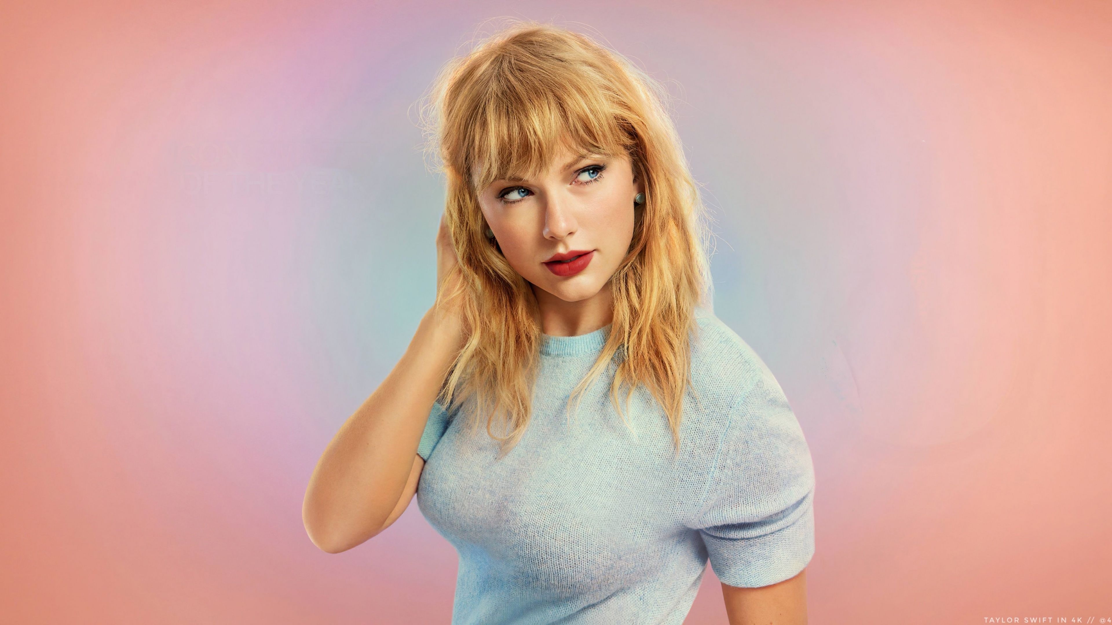 Taylor Swift in a blue top on a pink and blue background - Taylor Swift