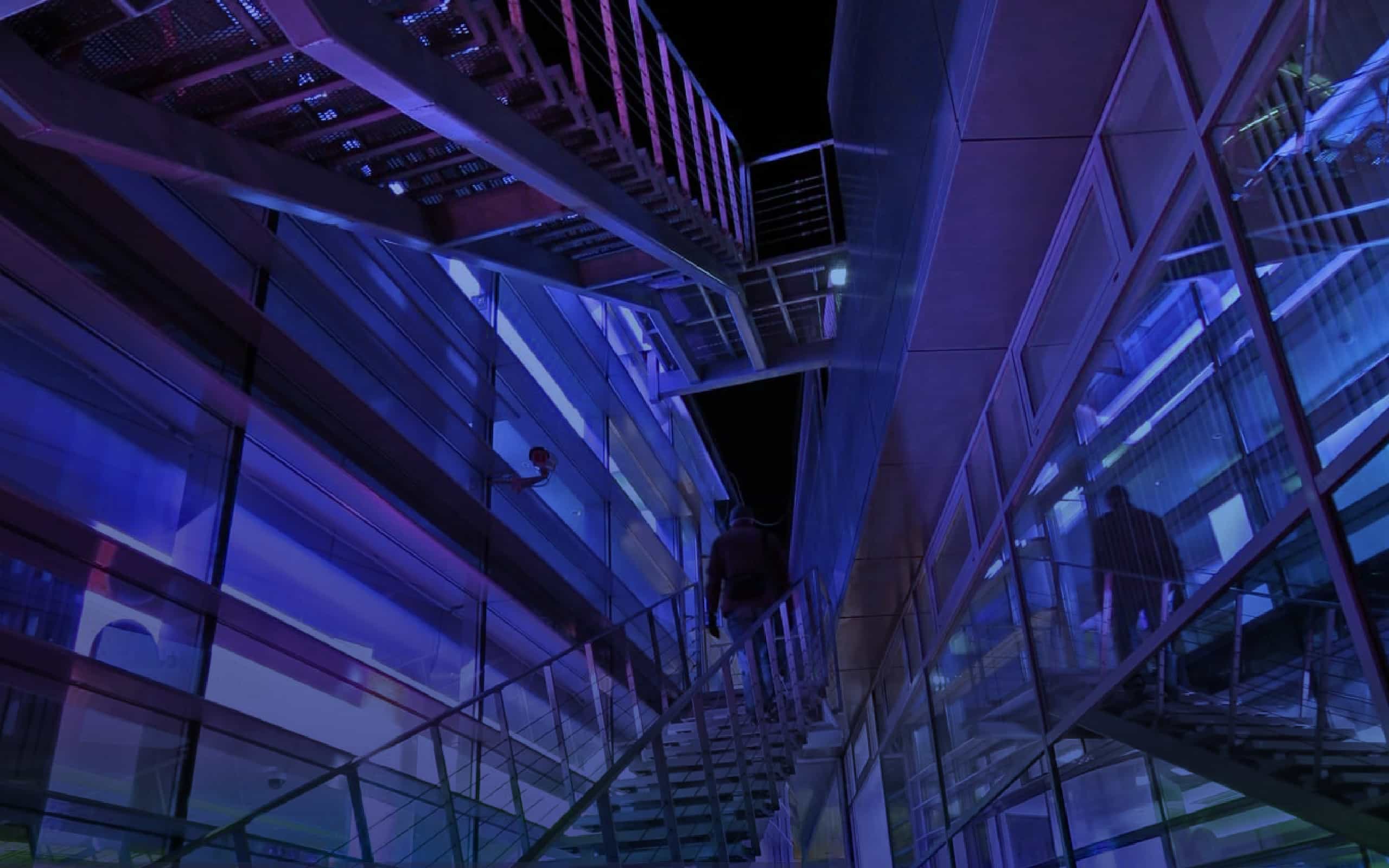 The stairs are lit with purple and blue lights. - 2560x1600