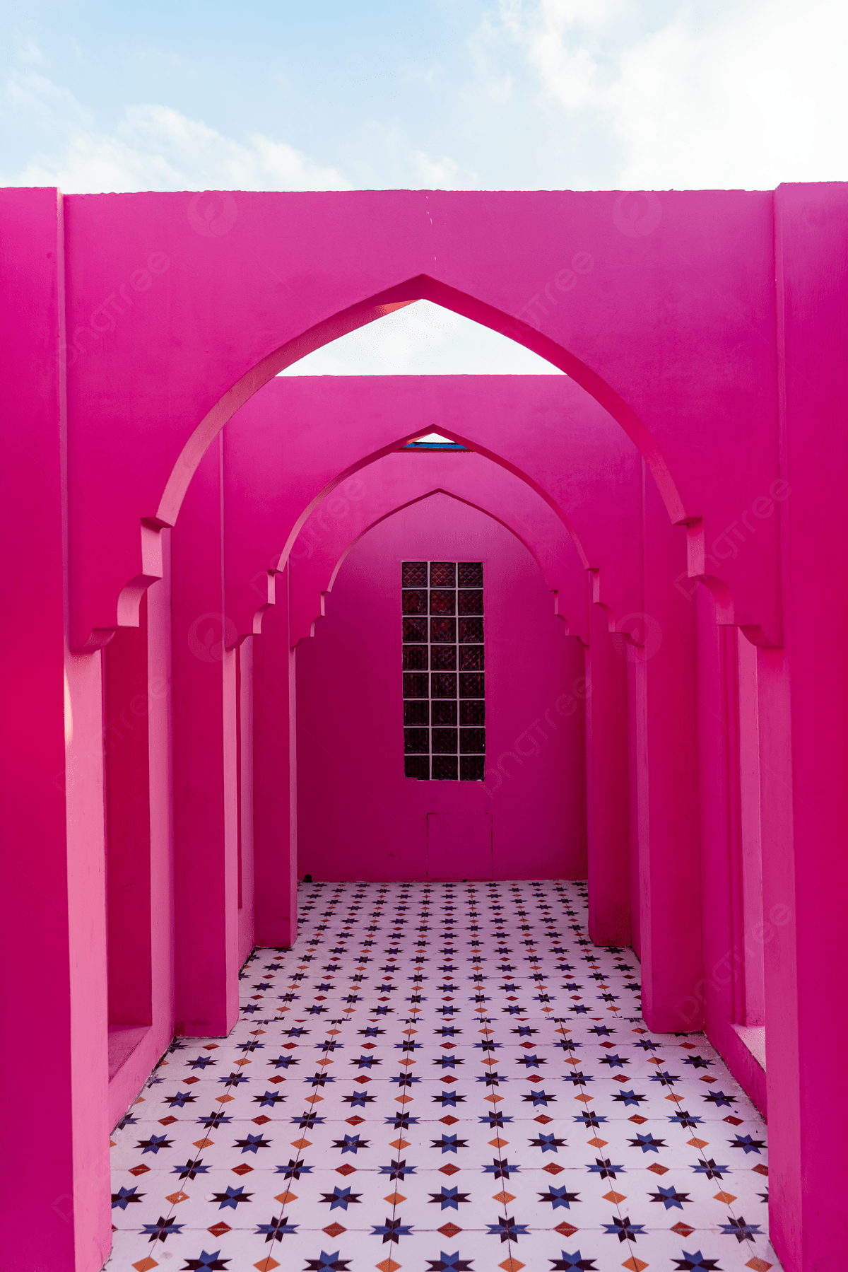 A pink hallway with a window and a patterned floor. - Magenta