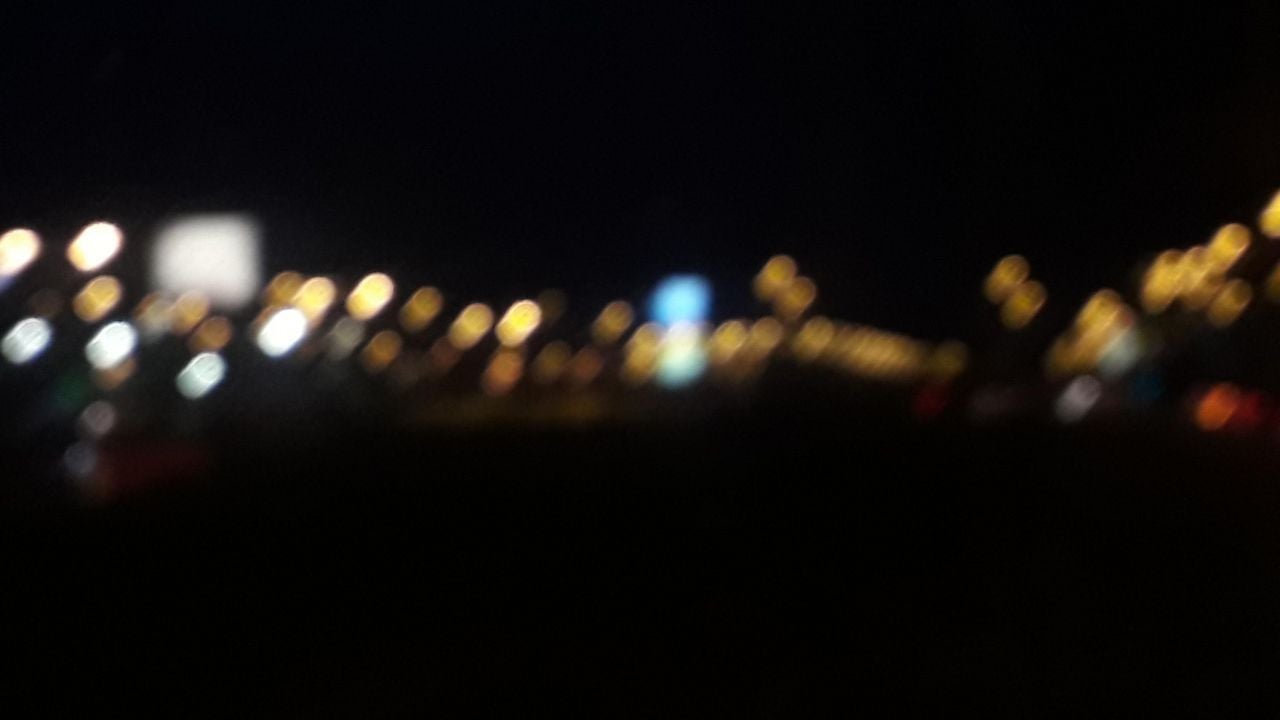 A blurry night scene with lights - Blurry