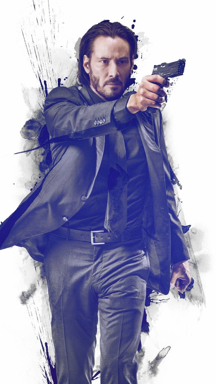 Keanu Reeves as John Wick, holding a gun and wearing a suit - John Wick