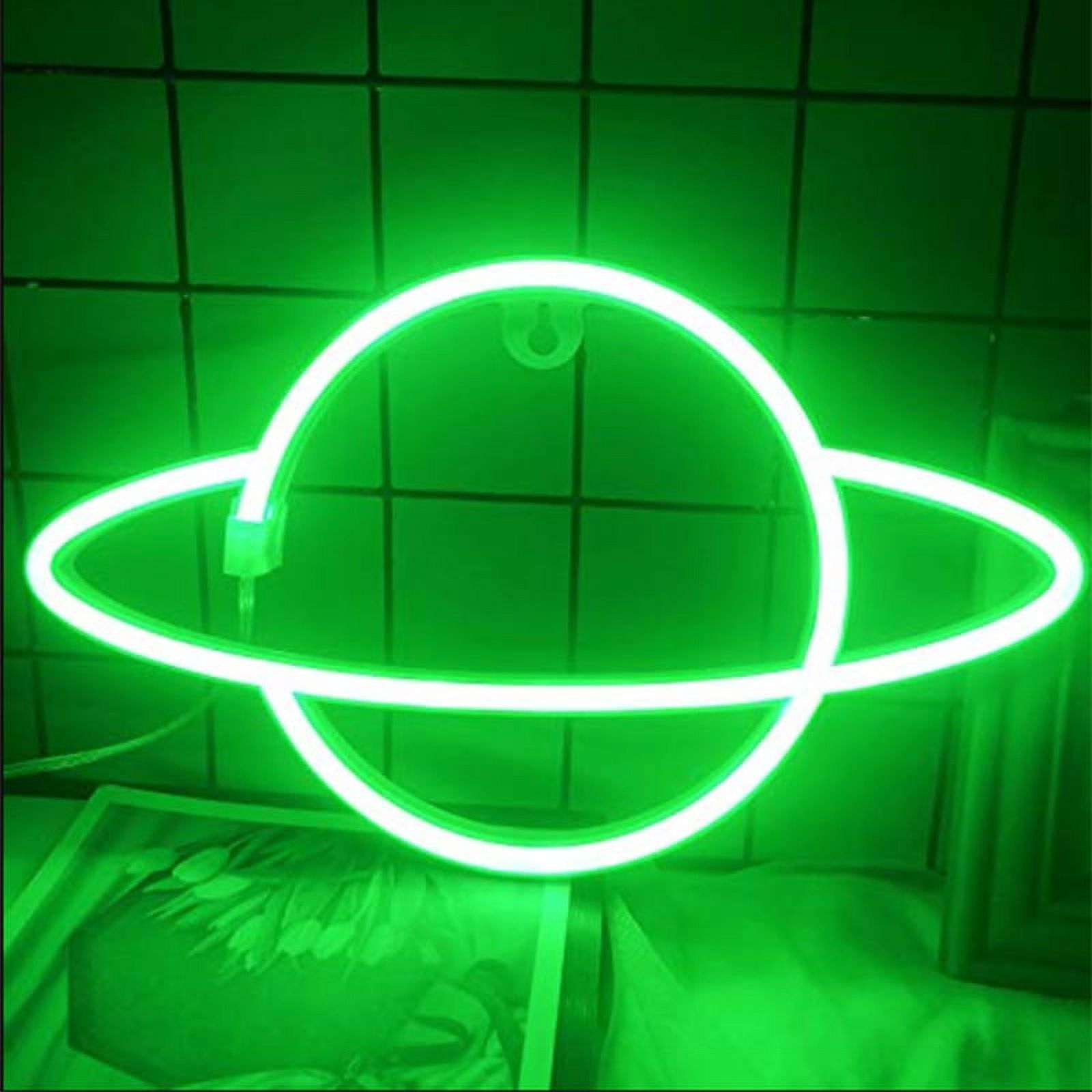 A green neon Saturn sign in a dark room. - Lime green
