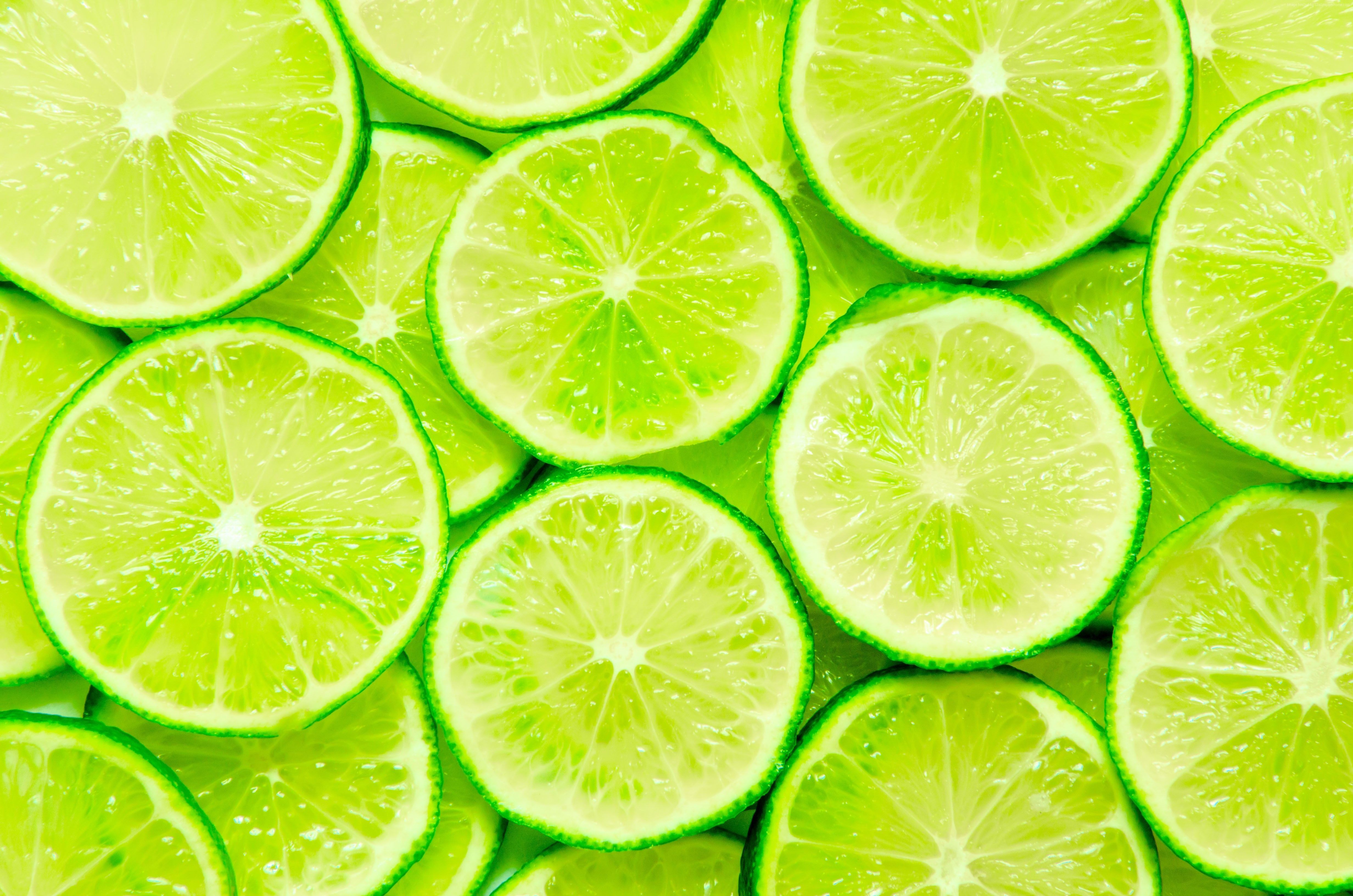 A close up of sliced limes - Lime green