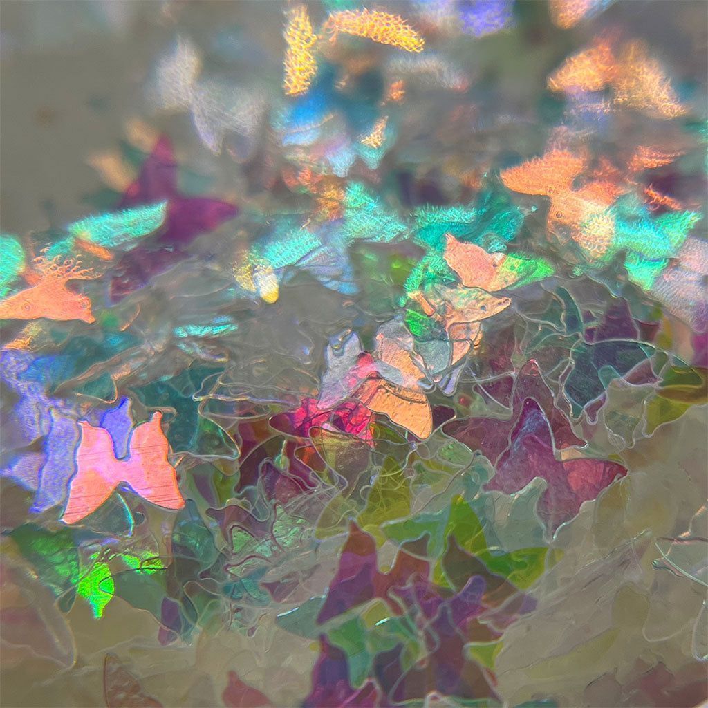 A photo of a broken glass with a rainbow of colors. - Iridescent